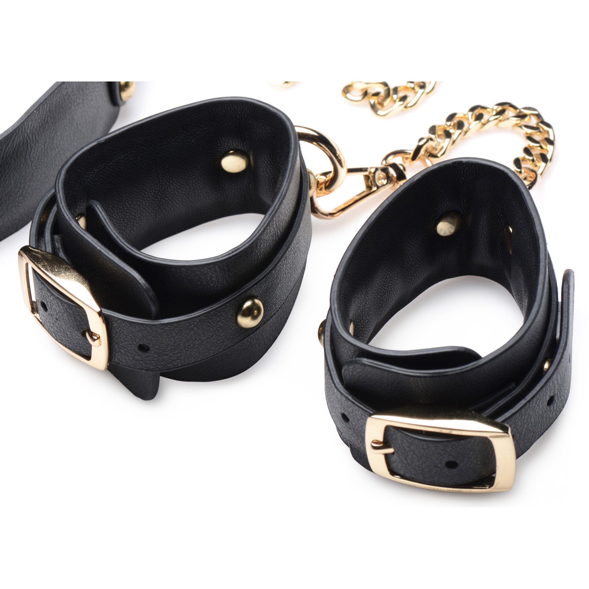 Gold Submission Bondage Kit featuring black leather cuffs, golden chains, and a blindfold, designed for BDSM play.