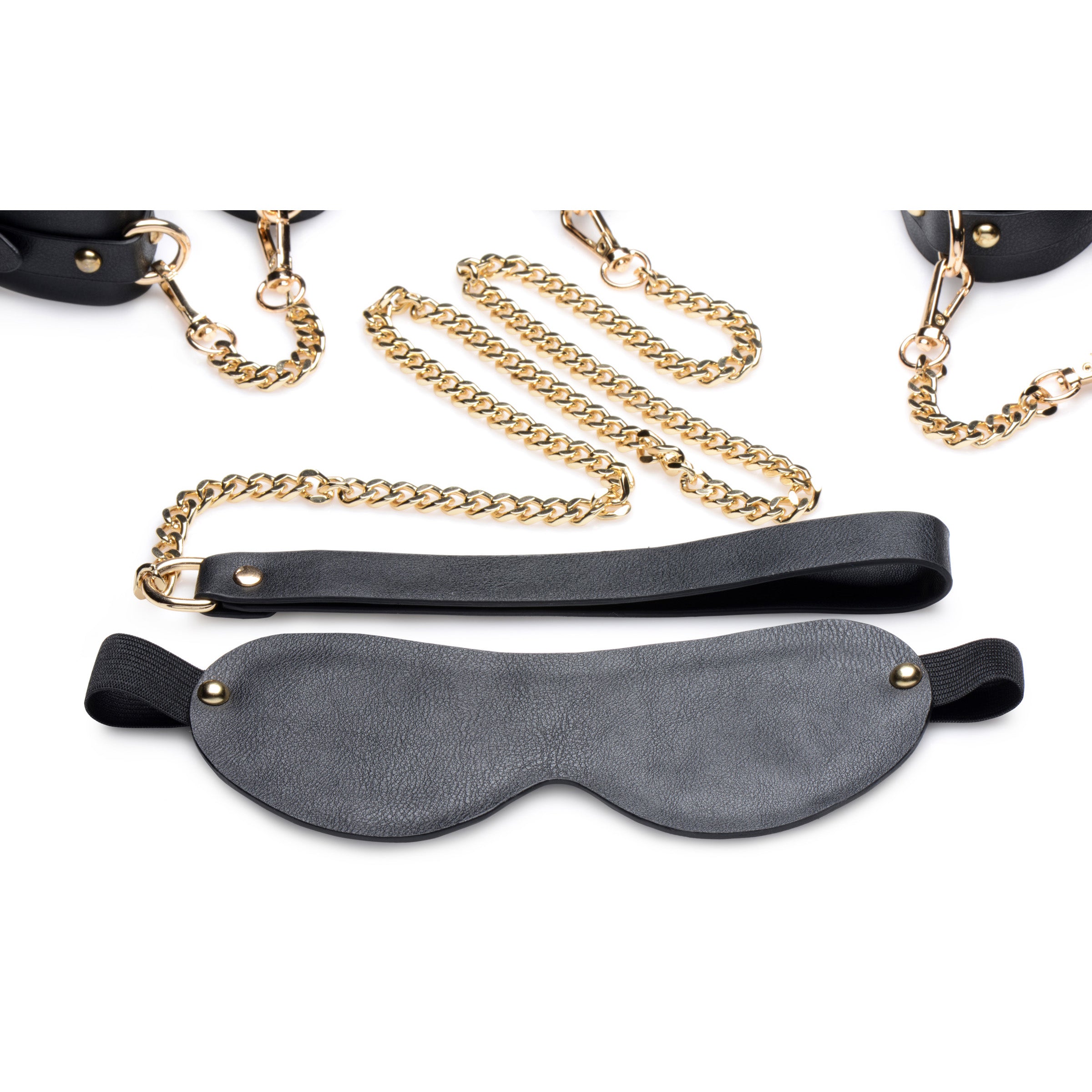 Gold Submission Bondage Kit featuring black leather cuffs, golden chains, and a blindfold, designed for BDSM play.