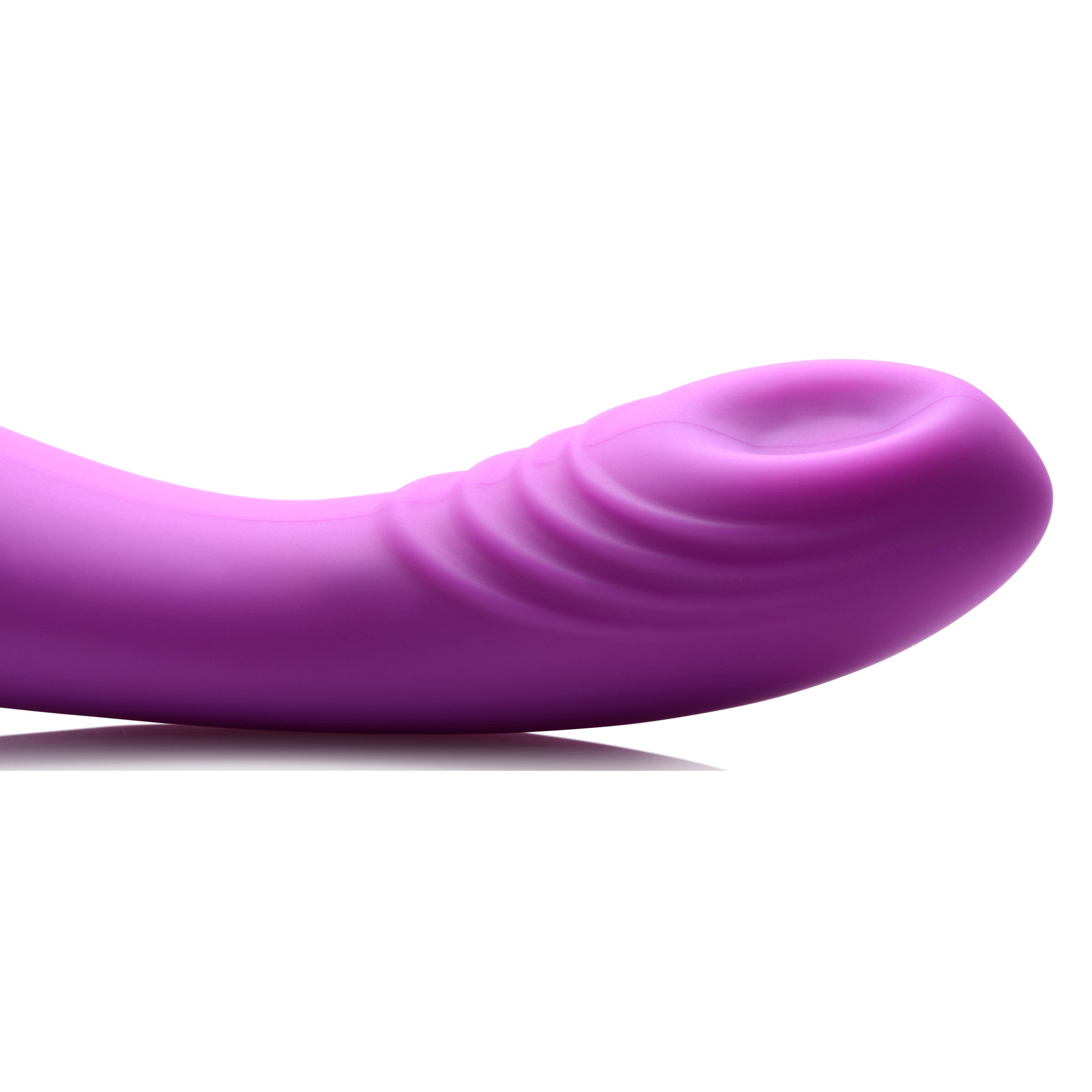 G-Thump Silicone G-spot Stimulator in purple, featuring a curved design and ridges for enhanced stimulation.