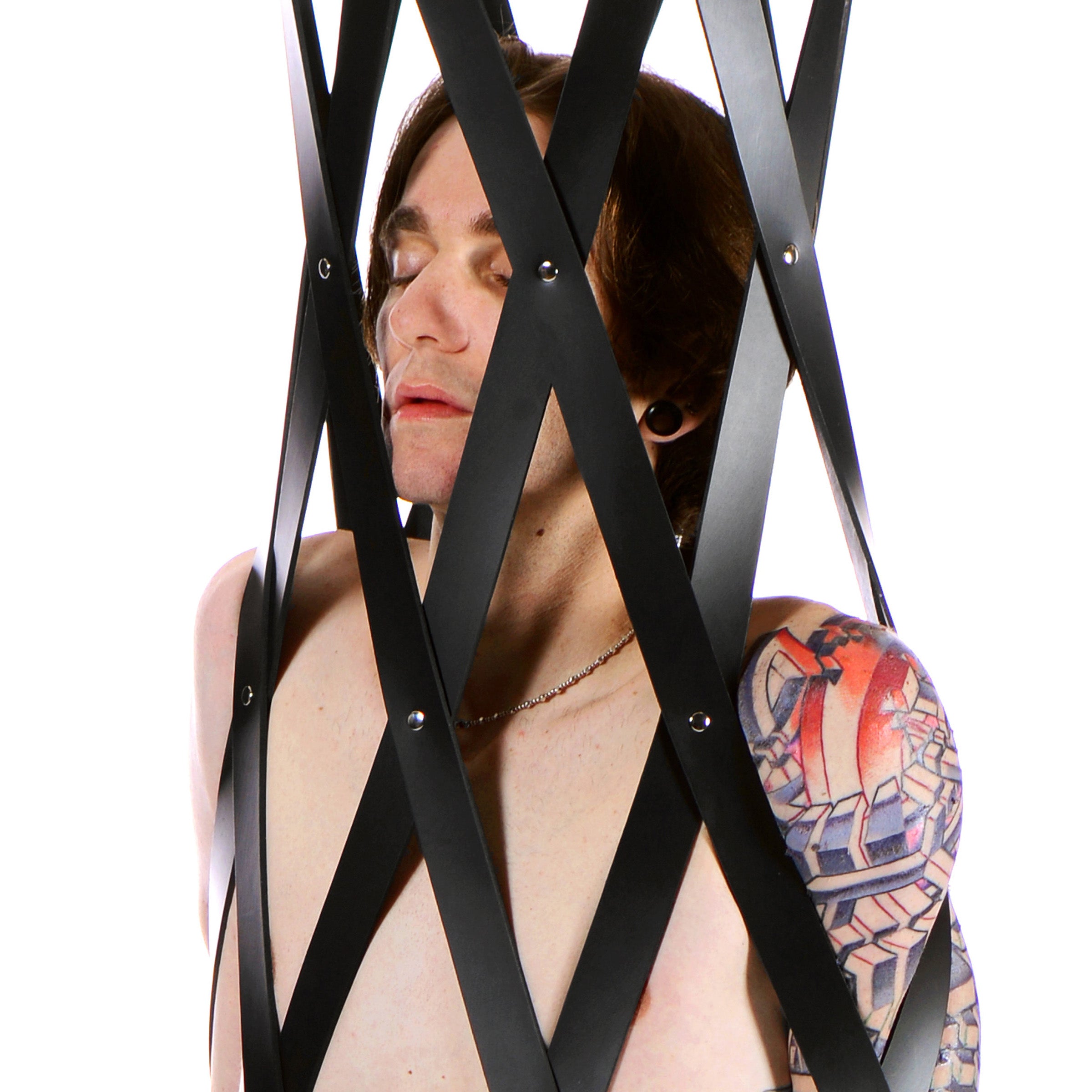 Hanging Rubber Strap Cage featuring thick rubber straps and a sturdy wooden platform, designed for bondage play.