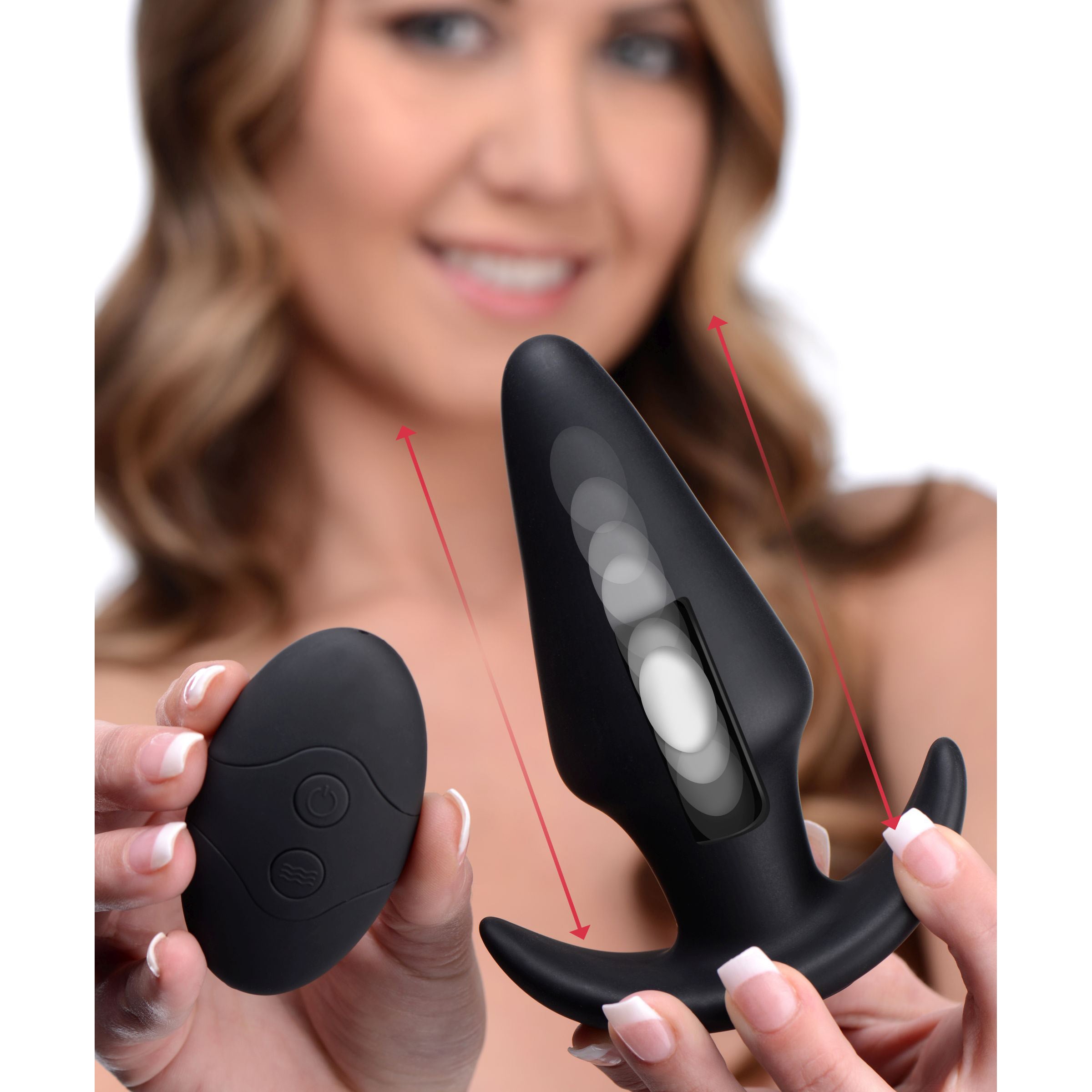 Kinetic Thumping 7X Large Anal Plug in black silicone with remote control, showcasing its tapered design and impressive girth.