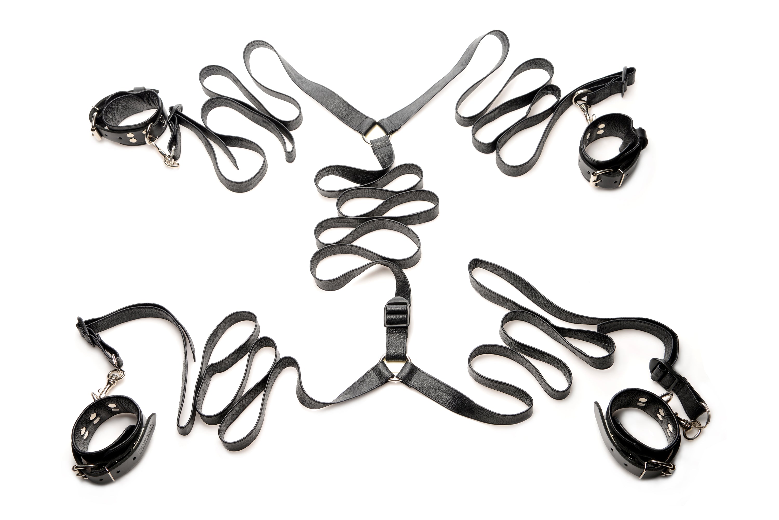 Luxurious Leather Bed Restraint Kit featuring adjustable straps and cuffs for bondage play.