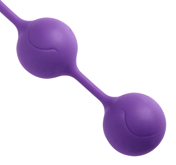 Lucca Weighted Silicone Ben Wa Balls in purple, showcasing their sleek design and easy retrieval cord.