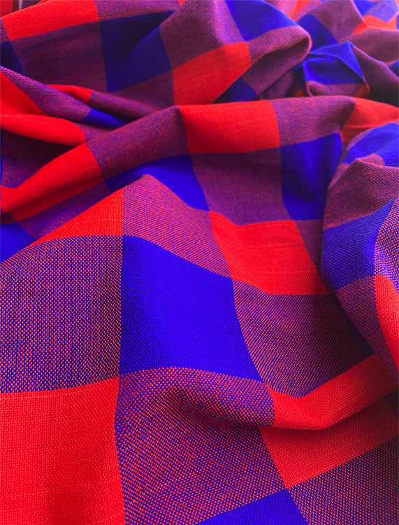 A vibrant Maasai Shuka throw blanket featuring traditional patterns, made from 100% acrylic, measuring approximately 150cm x 200cm, perfect for various uses.