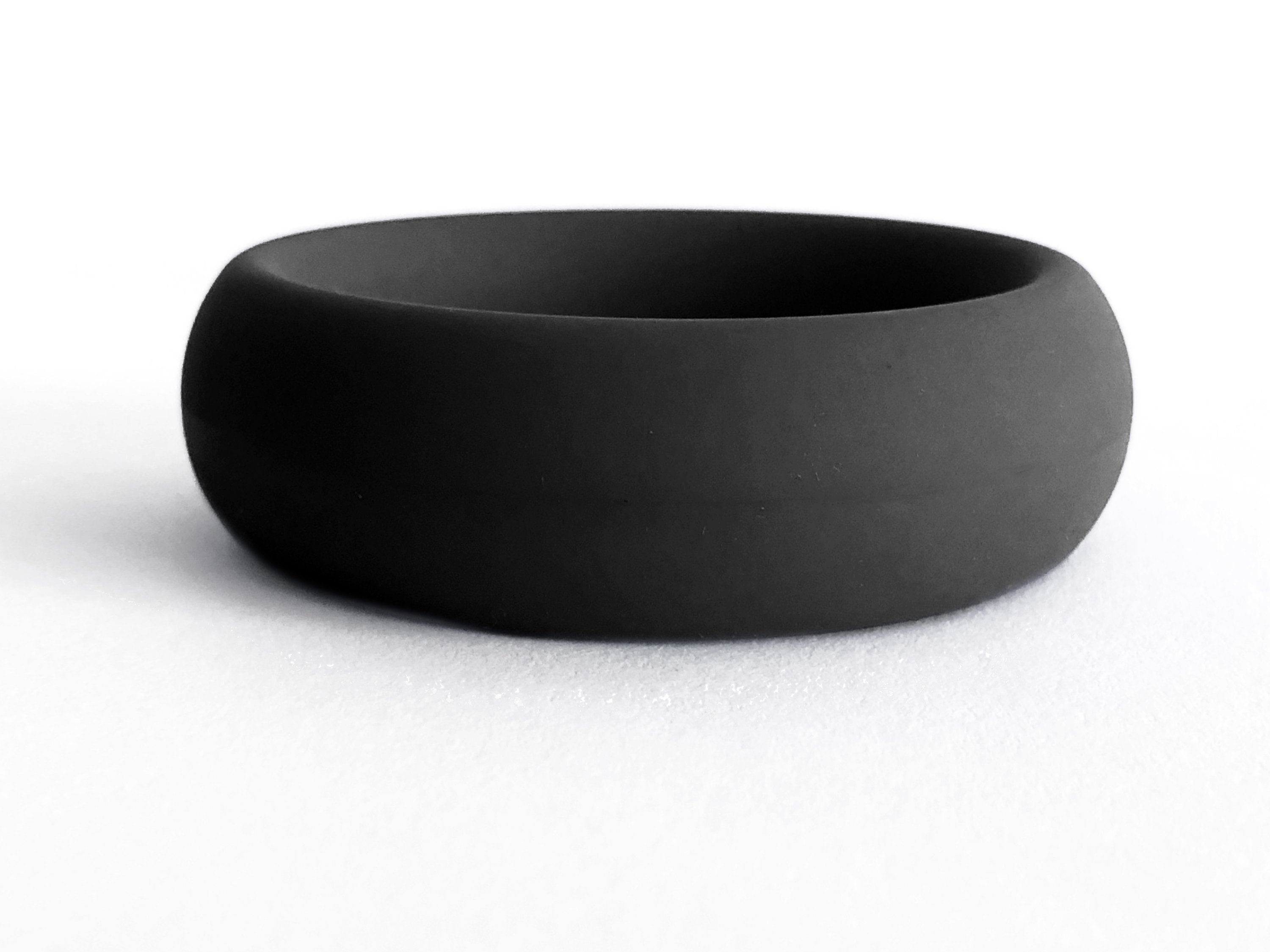 Meat Rack Black cock ring made of stretchy silicone, showcasing its thick girth and no-roll design for enhanced comfort and powerful erections.