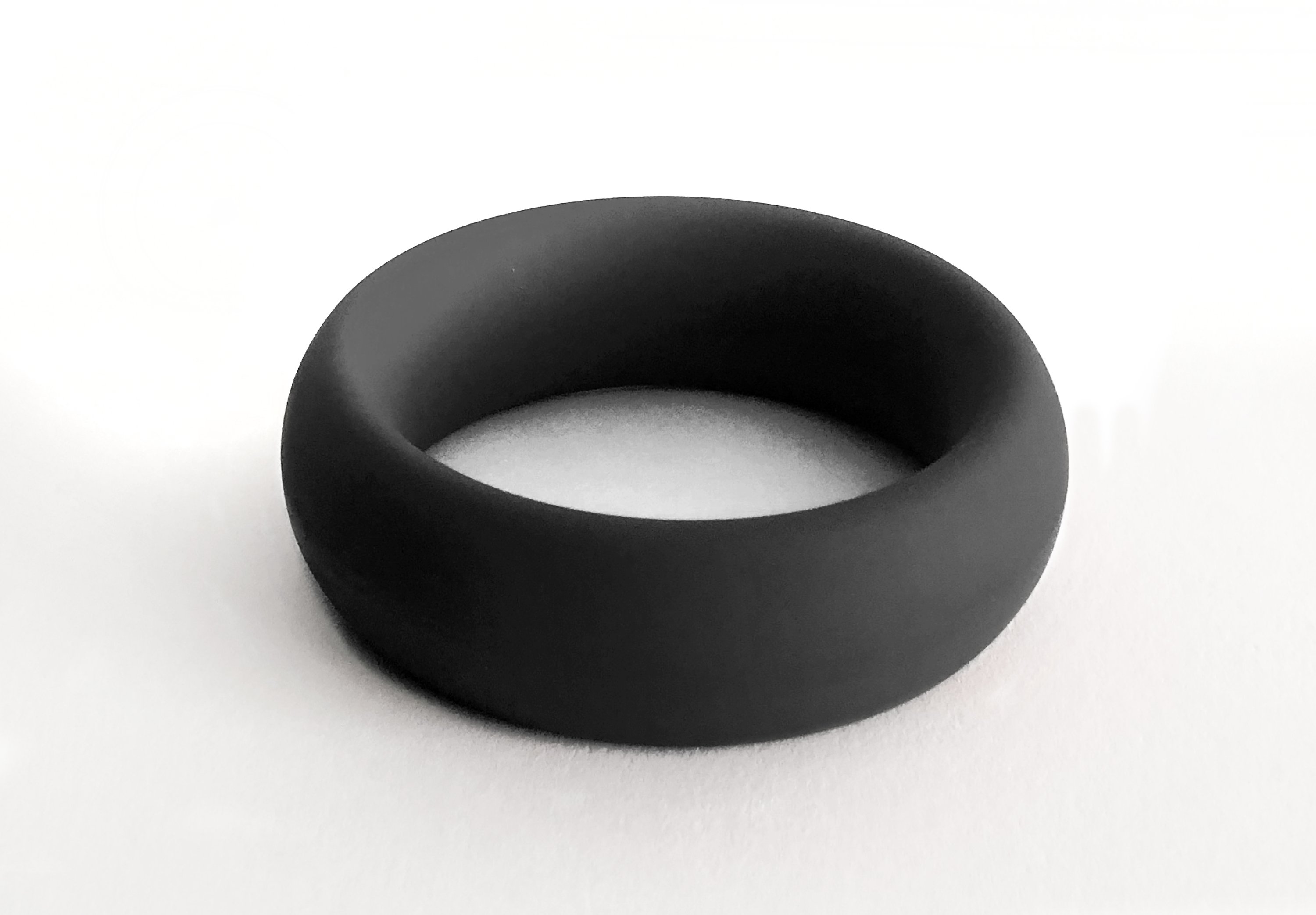 Meat Rack Black cock ring made of stretchy silicone, showcasing its thick girth and no-roll design for enhanced comfort and powerful erections.