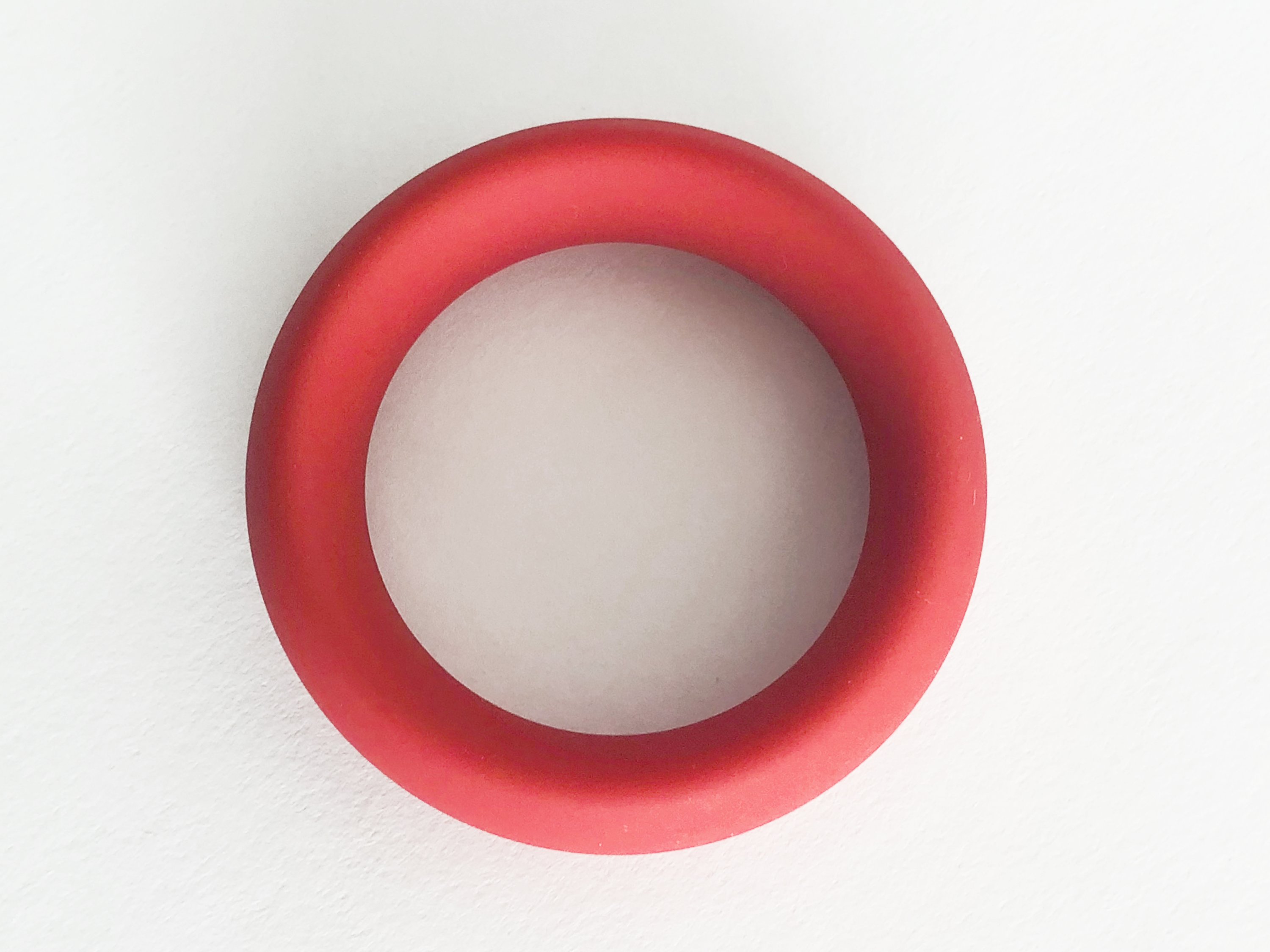 Meat Rack Red cock ring made of stretchy silicone, showcasing its thick girth and non-roll design for enhanced comfort and powerful erections.