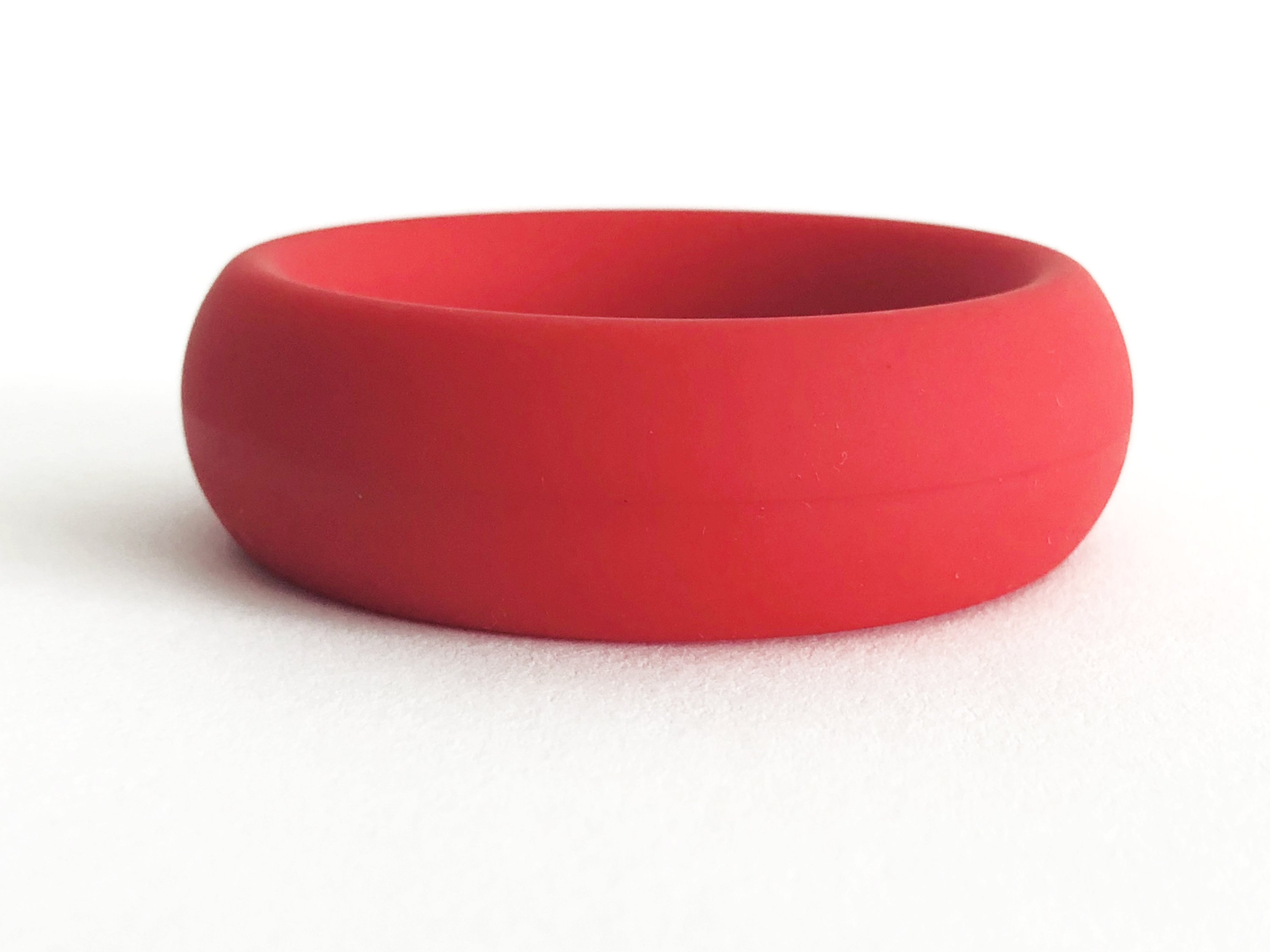 Meat Rack Red cock ring made of stretchy silicone, showcasing its thick girth and non-roll design for enhanced comfort and powerful erections.