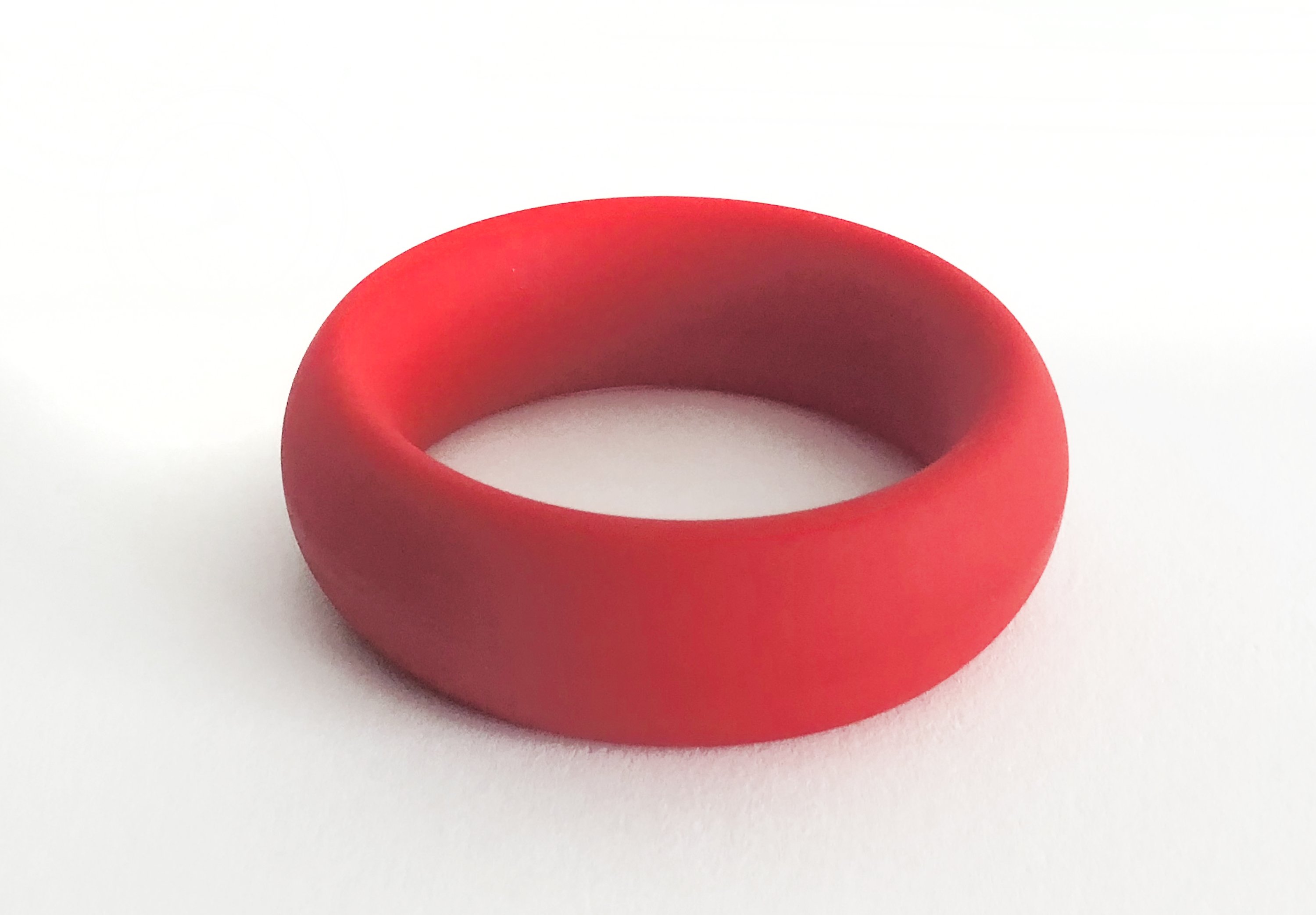 Meat Rack Red cock ring made of stretchy silicone, showcasing its thick girth and non-roll design for enhanced comfort and powerful erections.