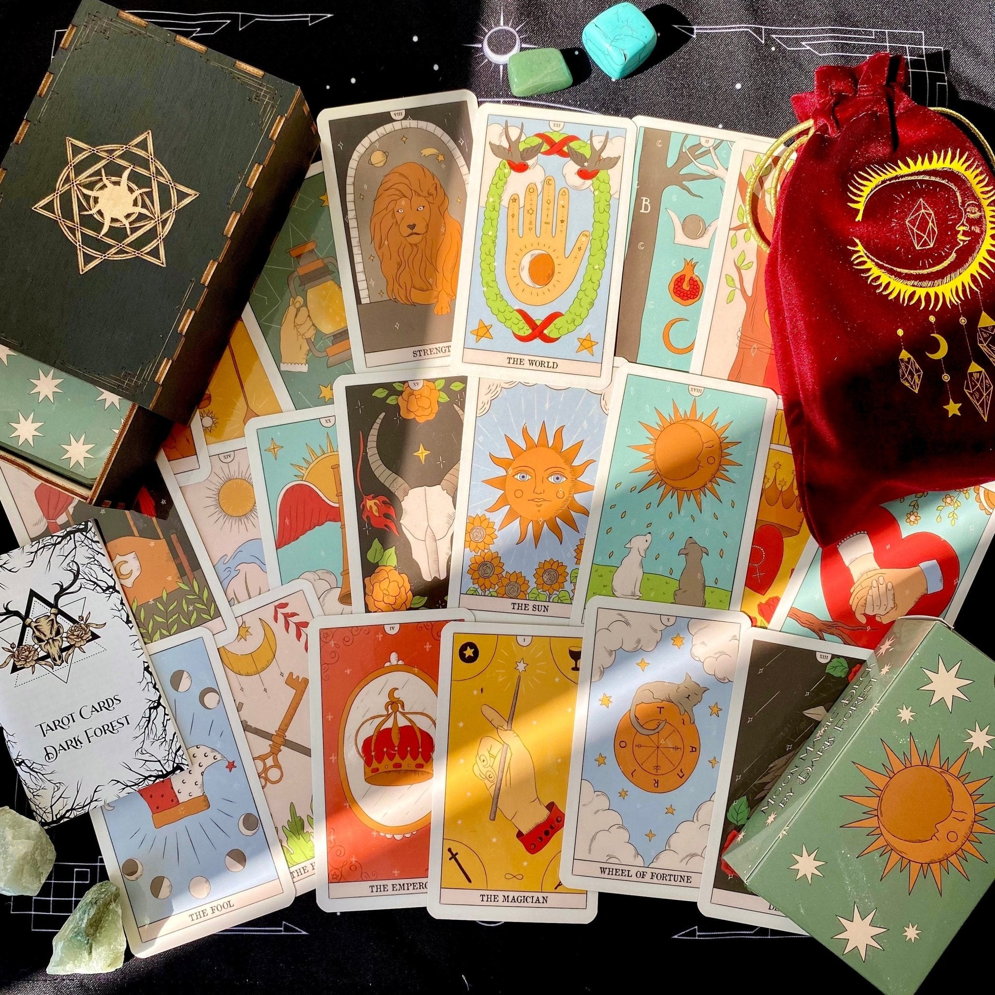 Moon Magic Tarot Deck featuring 78 beautifully designed cards, a guidebook, velvet bag, and wooden box, all in a stunning presentation.