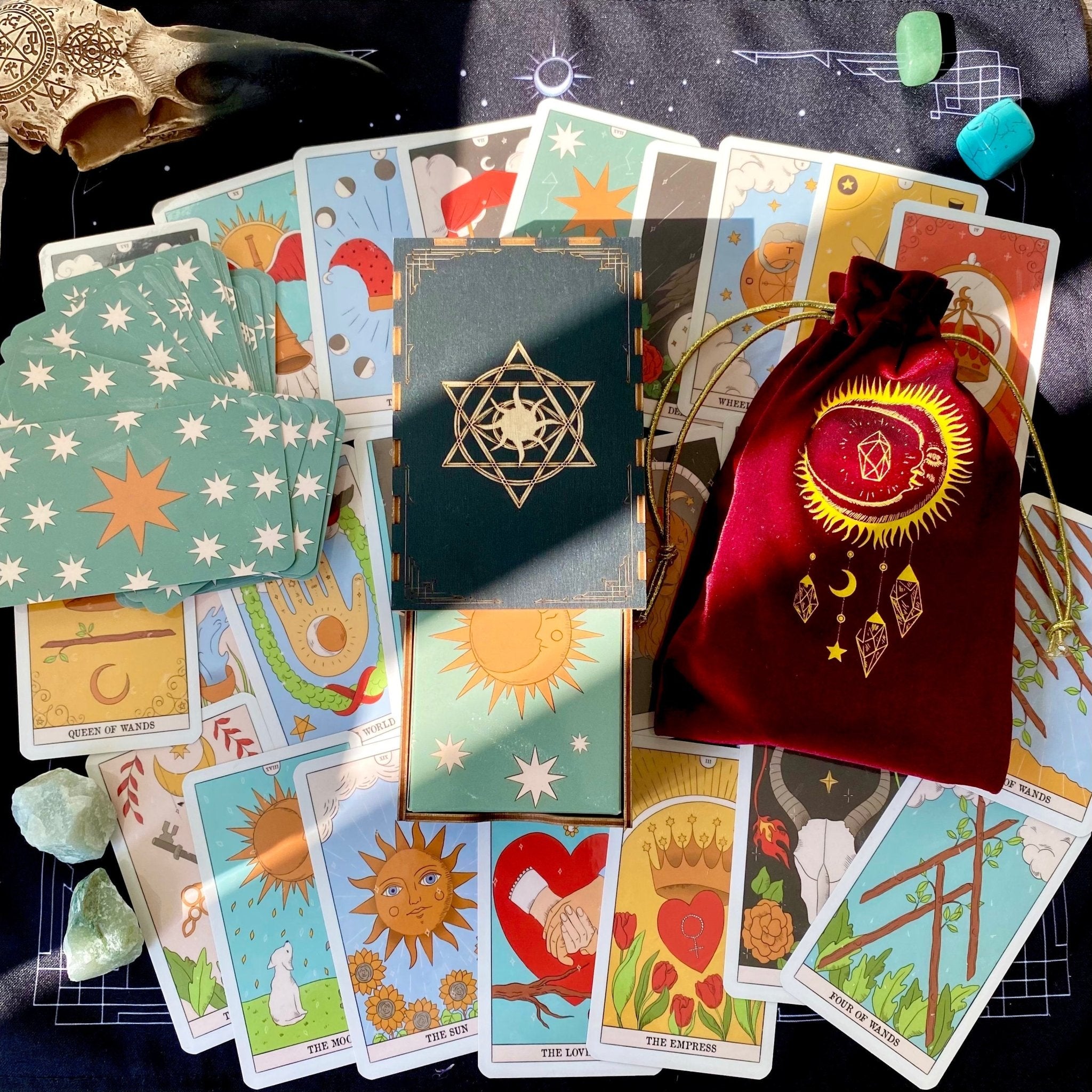 Moon Magic Tarot Deck featuring 78 beautifully designed cards, a guidebook, velvet bag, and wooden box, all in a stunning presentation.