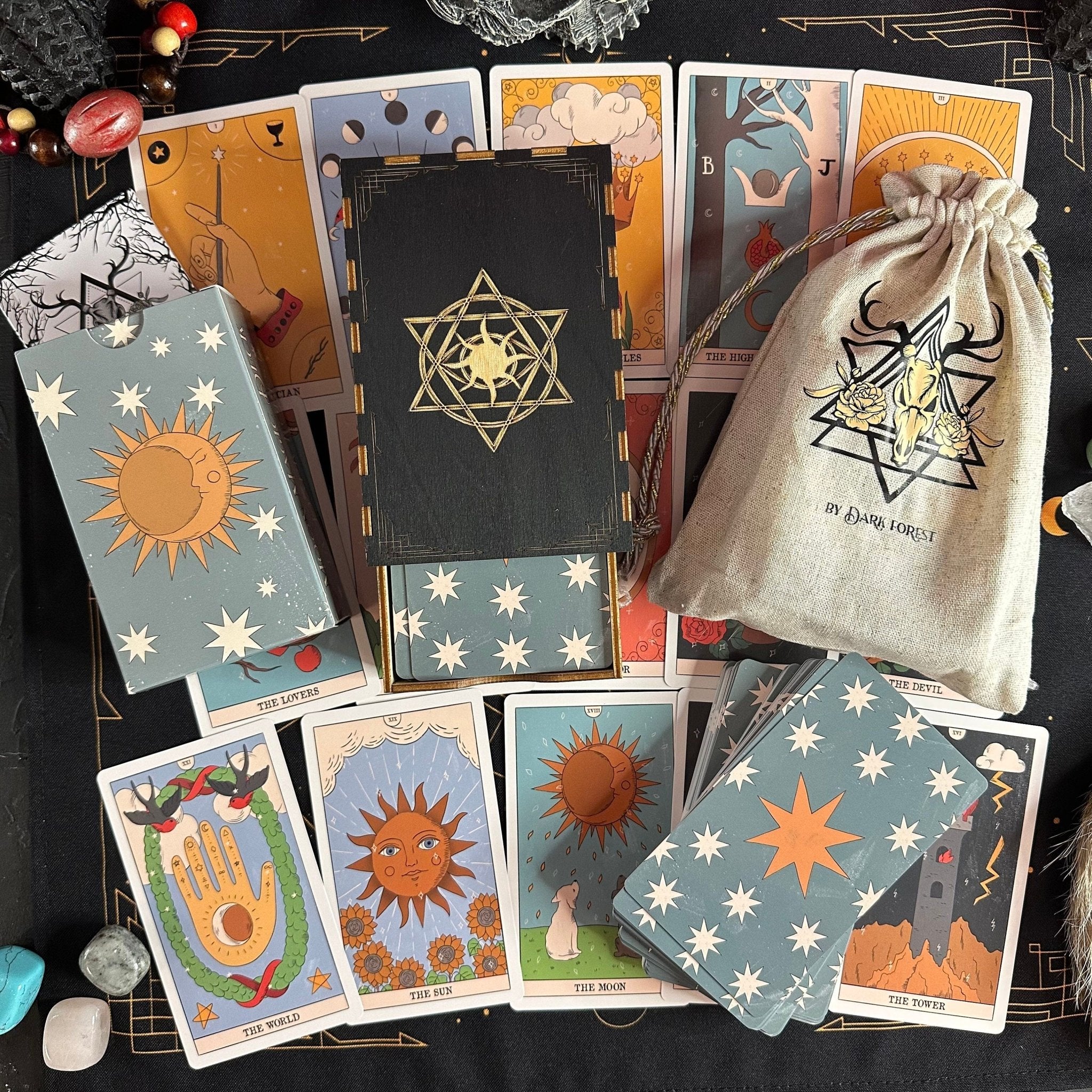 Moon Magic Tarot Deck featuring eco-friendly linen cardboard with vibrant illustrations and a guidebook, perfect for spiritual exploration.