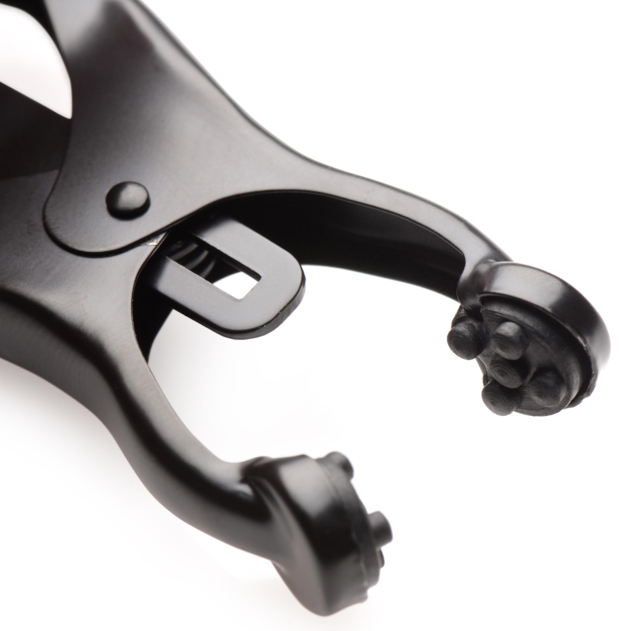 Monarch Noir Nipple Vice, a sleek black metal nipple clamp with adjustable chain for enhanced pleasure.