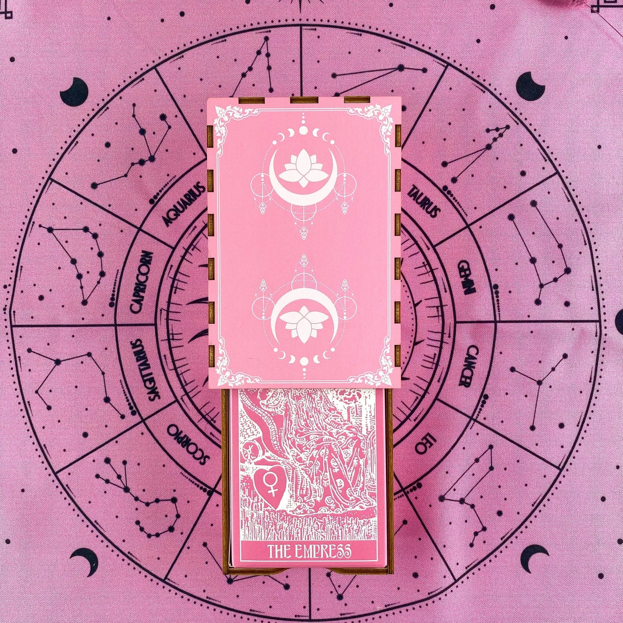 Pink White Tarot Deck featuring 78 cards, a guidebook, and stylish accessories including a velvet bag and wooden box.