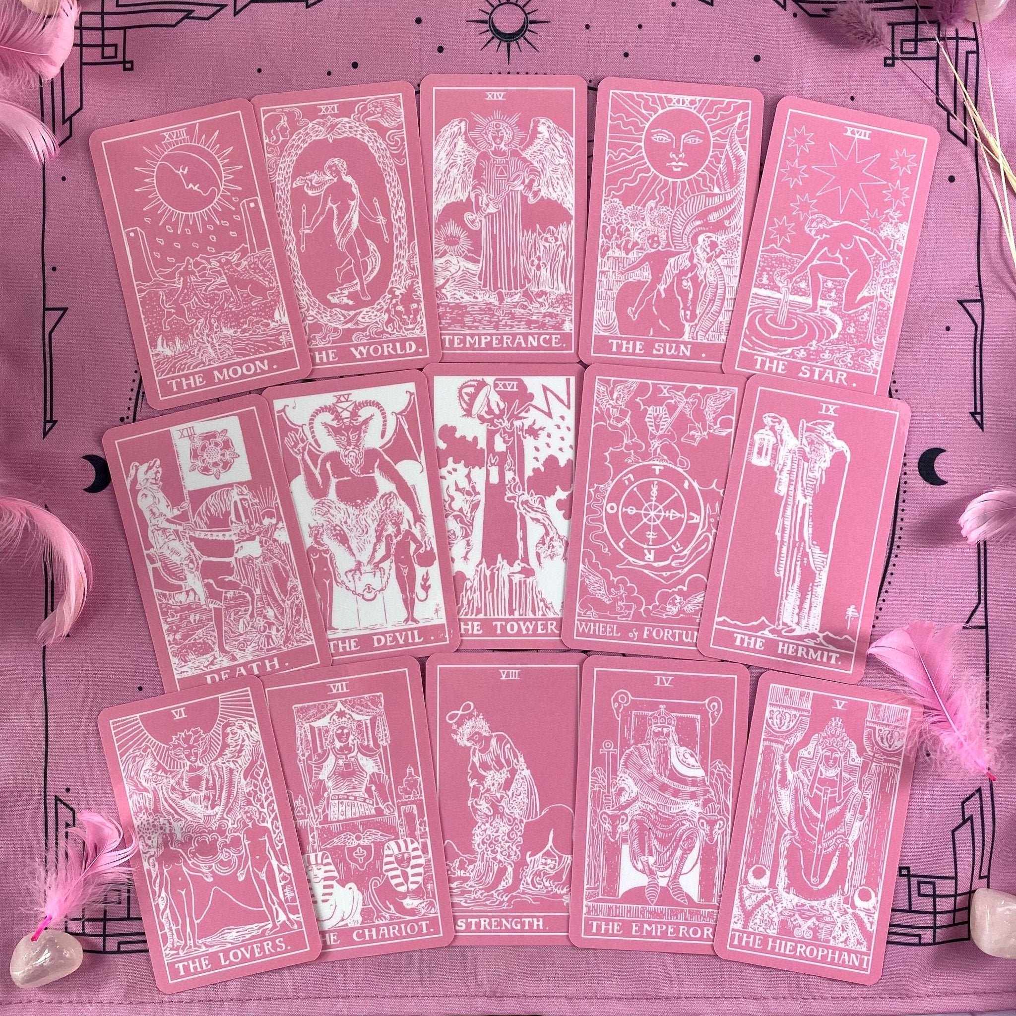 Pink White Tarot Deck featuring 78 cards, a guidebook, and stylish accessories including a velvet bag and wooden box.