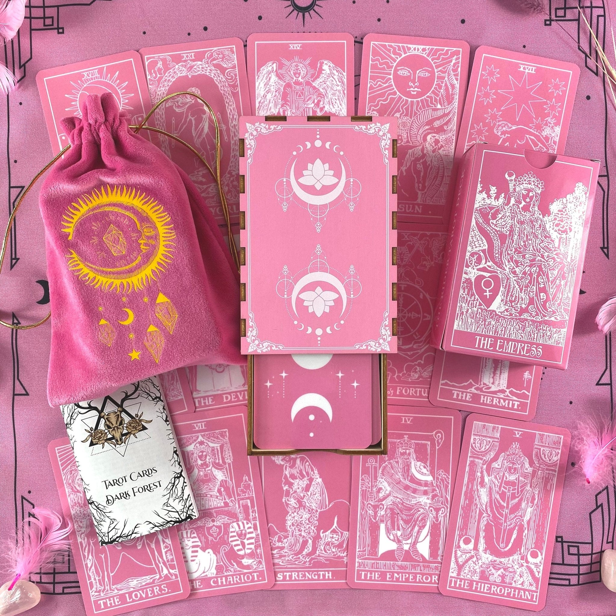 Pink White Tarot Deck featuring 78 cards, a guidebook, and stylish accessories including a velvet bag and wooden box.