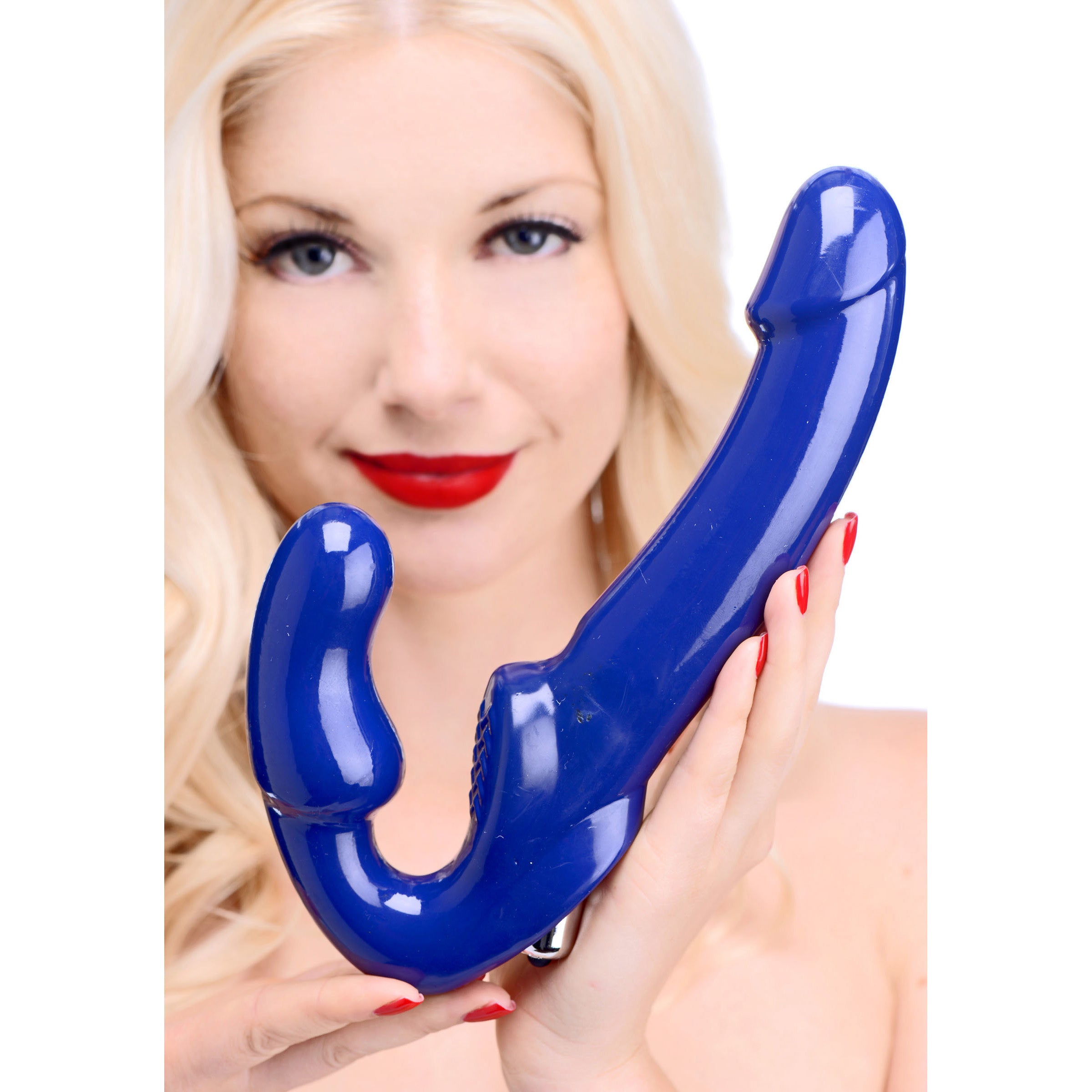 Revolver II Vibrating Strapless Strap On Dildo in blue, showcasing its curved shaft and textured clitoral pad for enhanced pleasure.