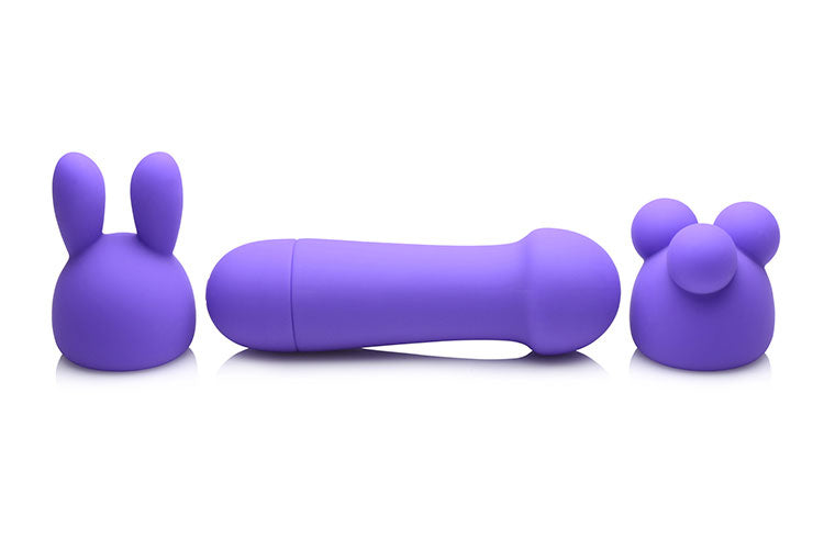 Rocket 10X Silicone Rechargeable Mini Wand with two attachments, showcasing its sleek design and vibrant violet color.