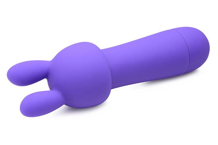 Rocket 10X Silicone Rechargeable Mini Wand with two attachments, showcasing its sleek design and vibrant violet color.