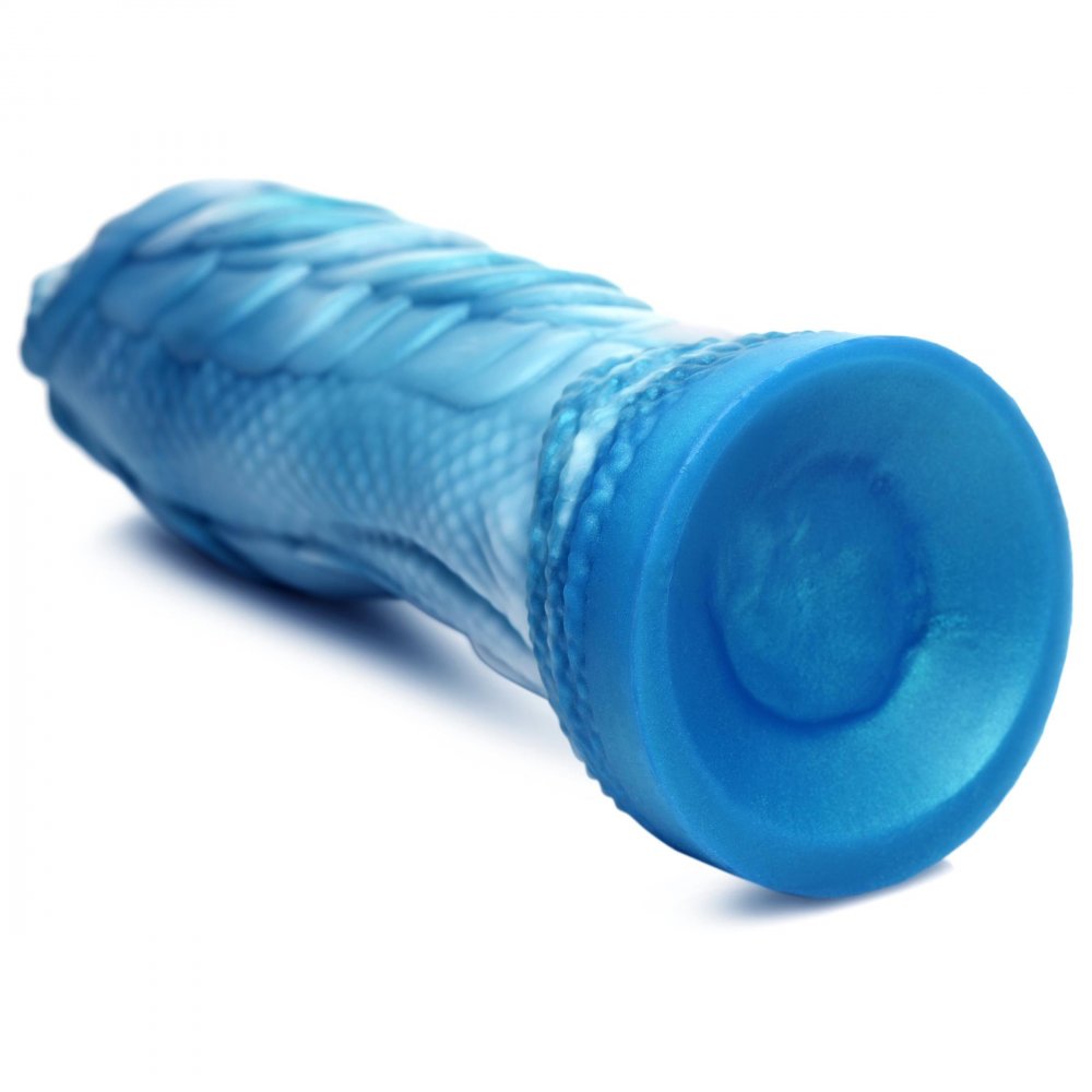 A blue and white silicone dildo shaped like a sea serpent, featuring textured scales and a suction cup base for hands-free use.