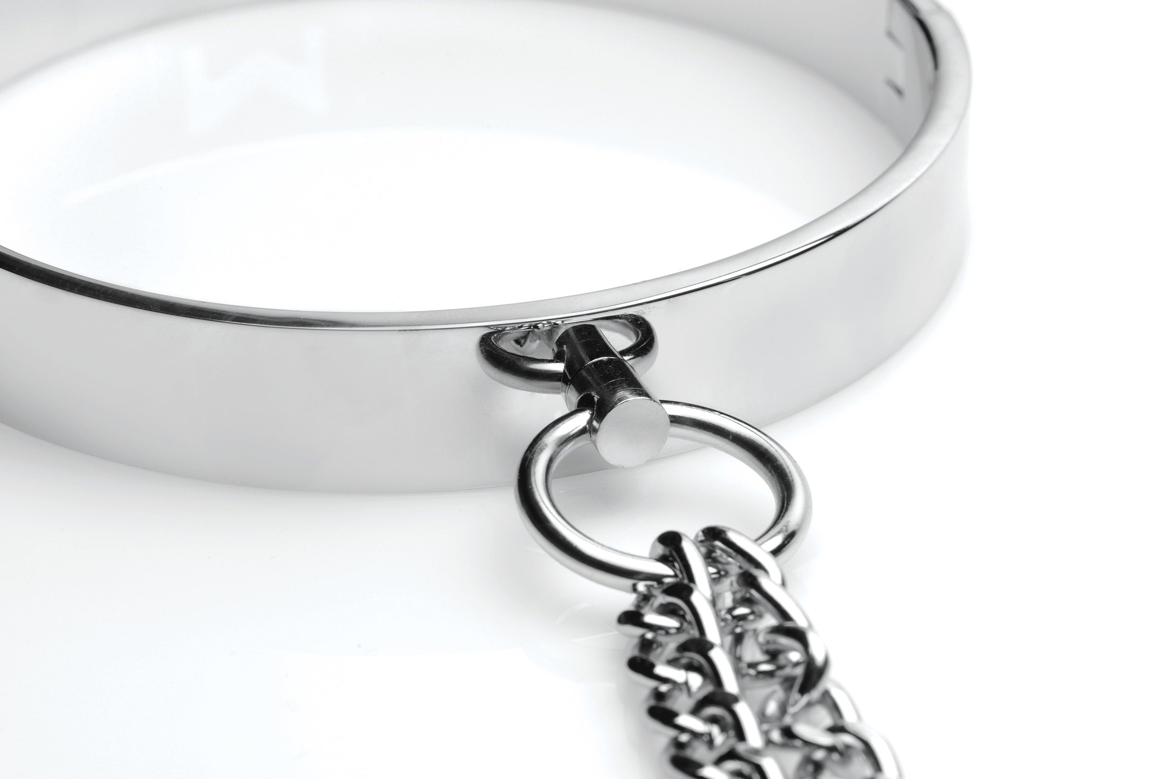 Sleek chrome slave collar with adjustable nipple clamps and chains, designed for BDSM play.