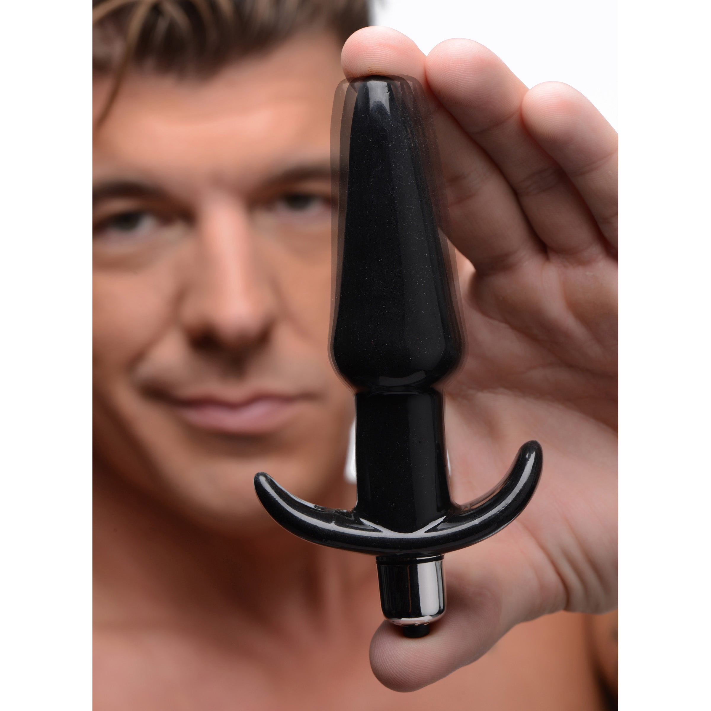 Smooth Vibrating Anal Plug in black, featuring a tapered tip and narrow base for comfortable anal play.