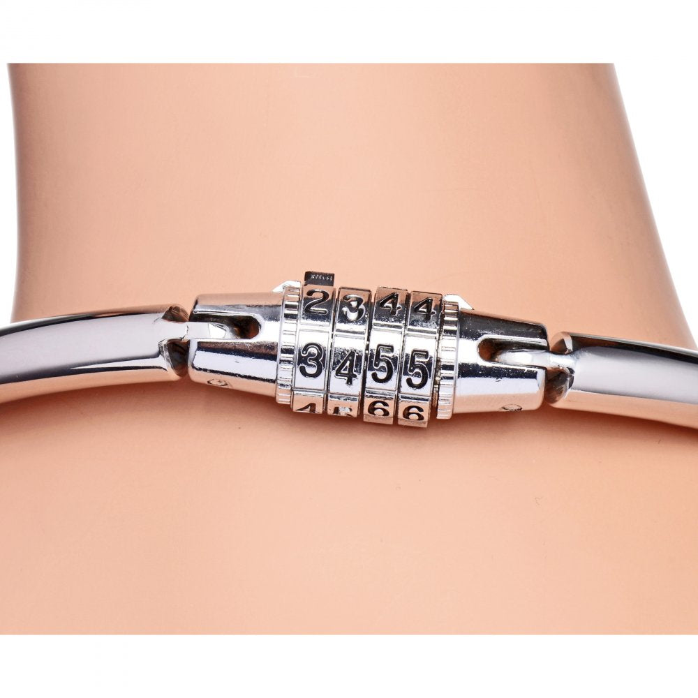 A stainless steel combination lock slave collar with smooth edges and an O-ring for attachments, symbolizing submission in BDSM.