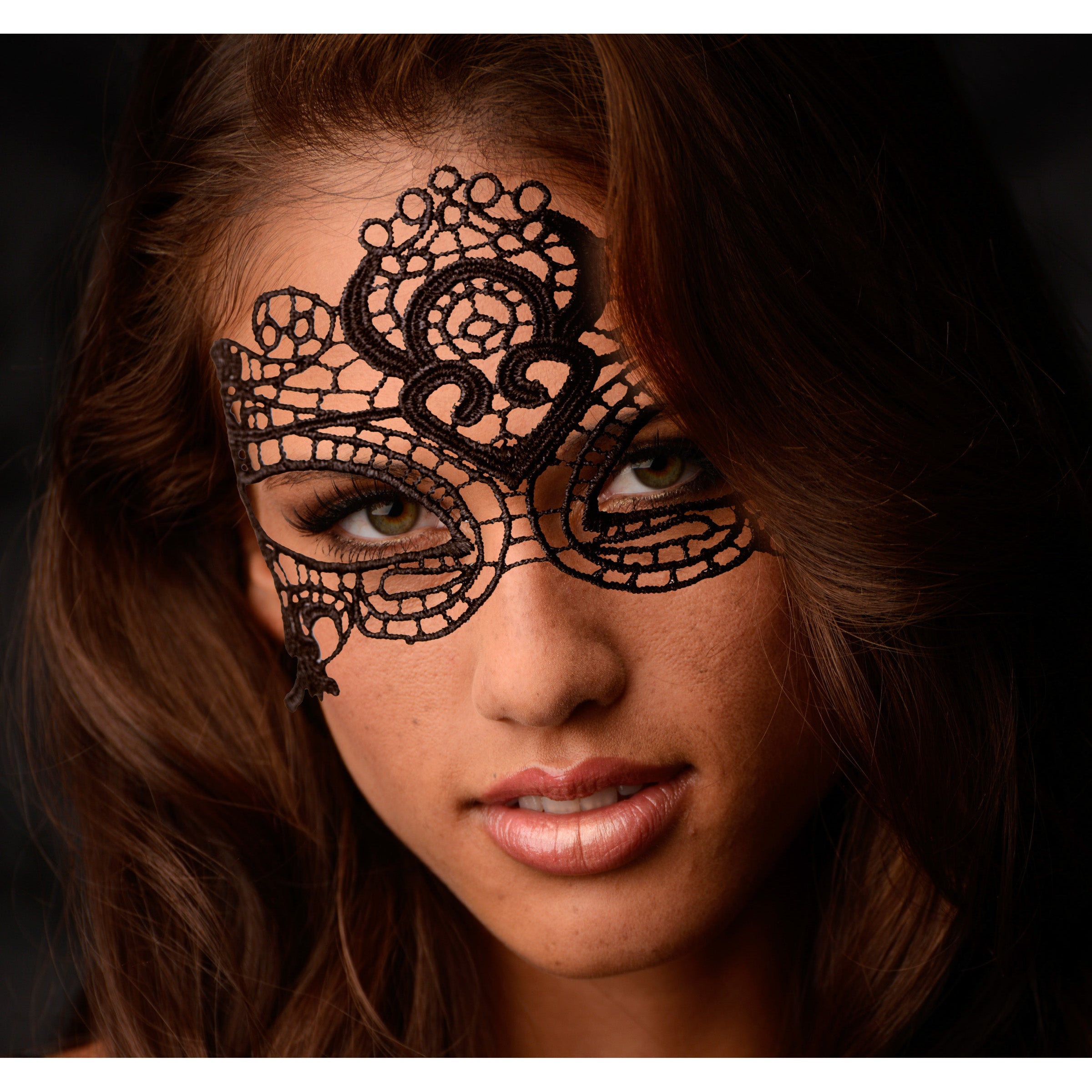 The Enchanted Black Lace Mask showcasing intricate lace details and open eye design, secured with delicate lace ties.