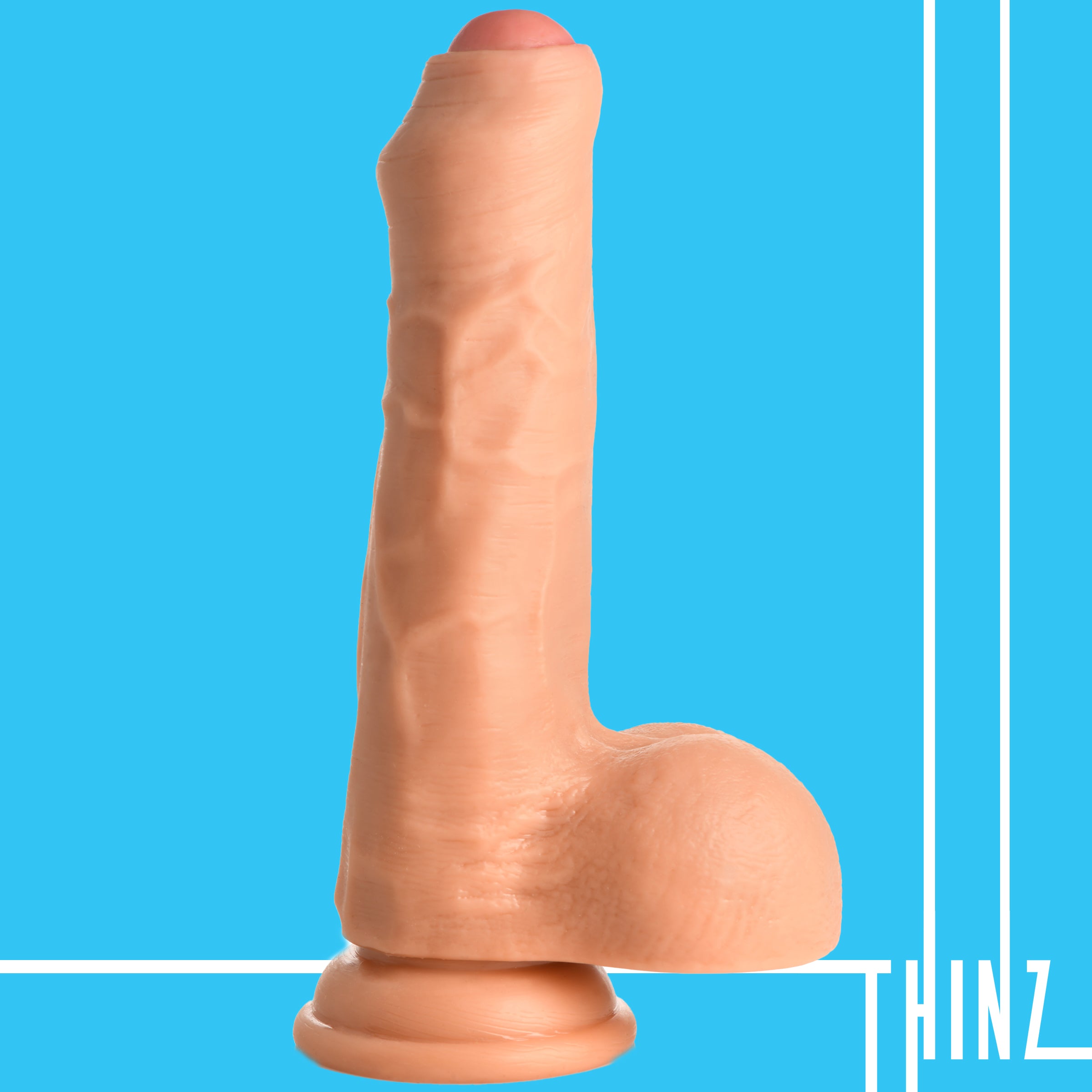 Thinz 7" Uncut Dildo with Balls, featuring realistic details and a strong suction cup base for hands-free pleasure.