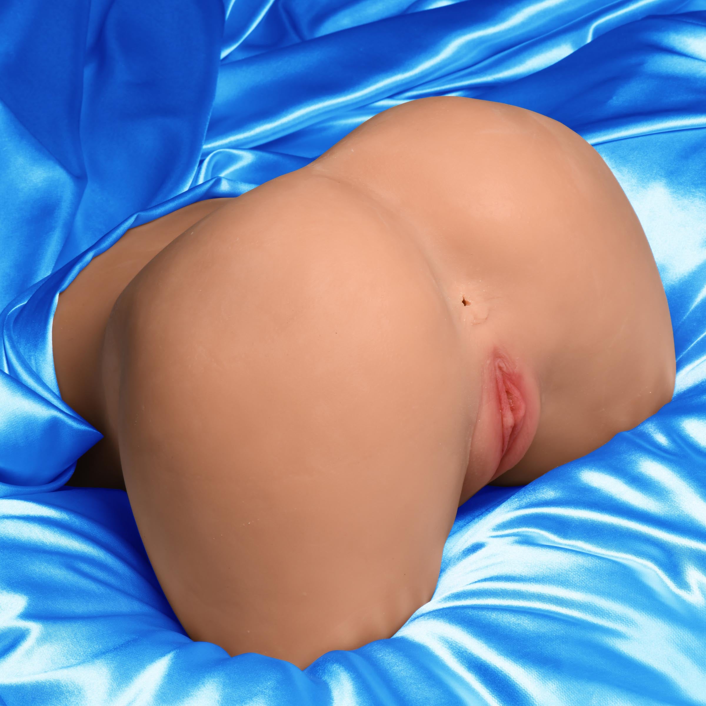 Vibrating Pussy and Ass Masturbator made from life-like BioSkin TPE, showcasing realistic textures and remote control features.