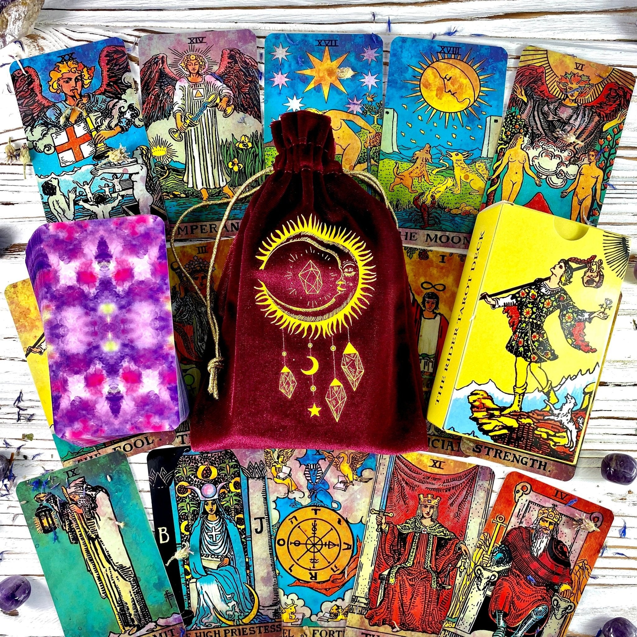 Colorful tarot cards and velvet pouch.