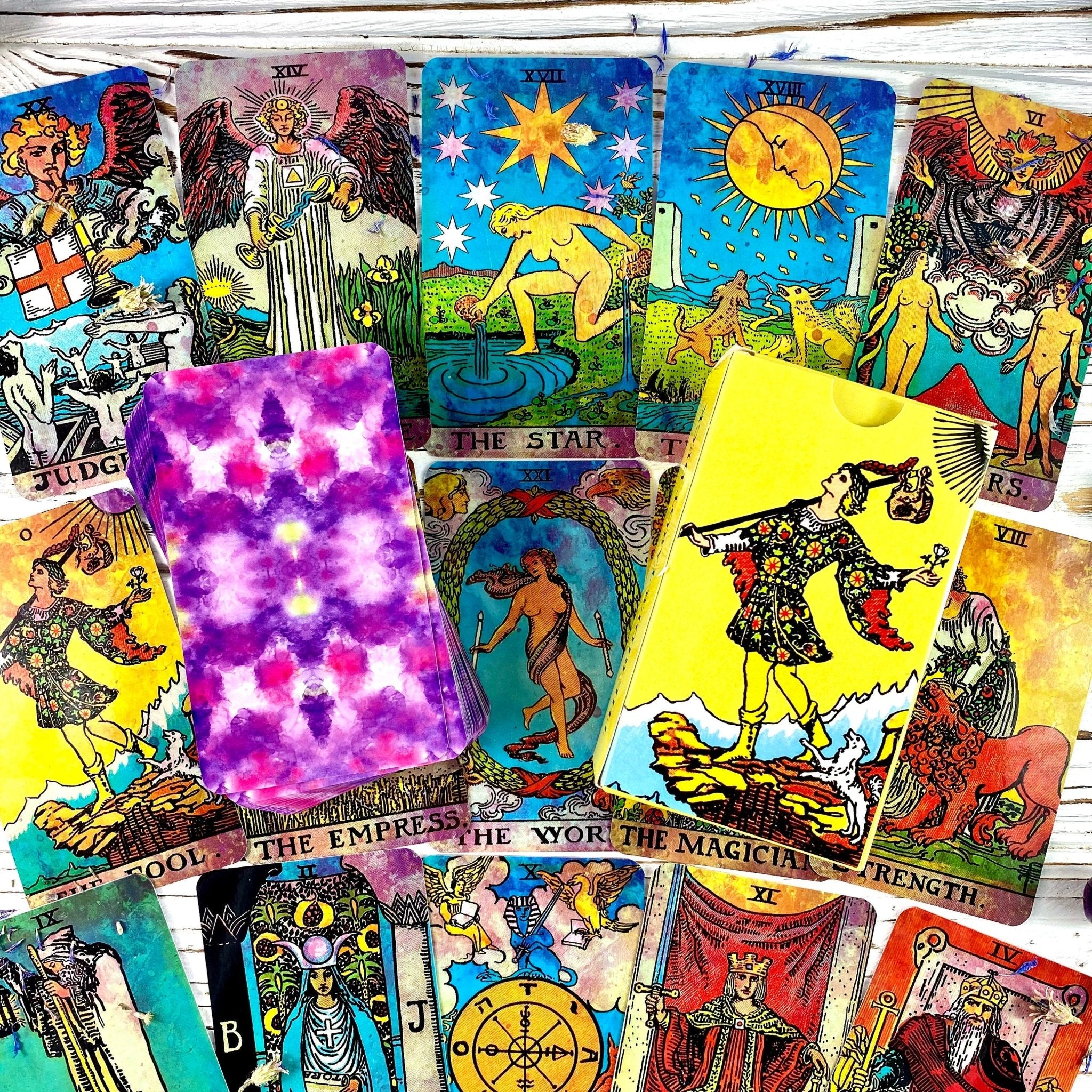 Colorful tarot cards spread out.