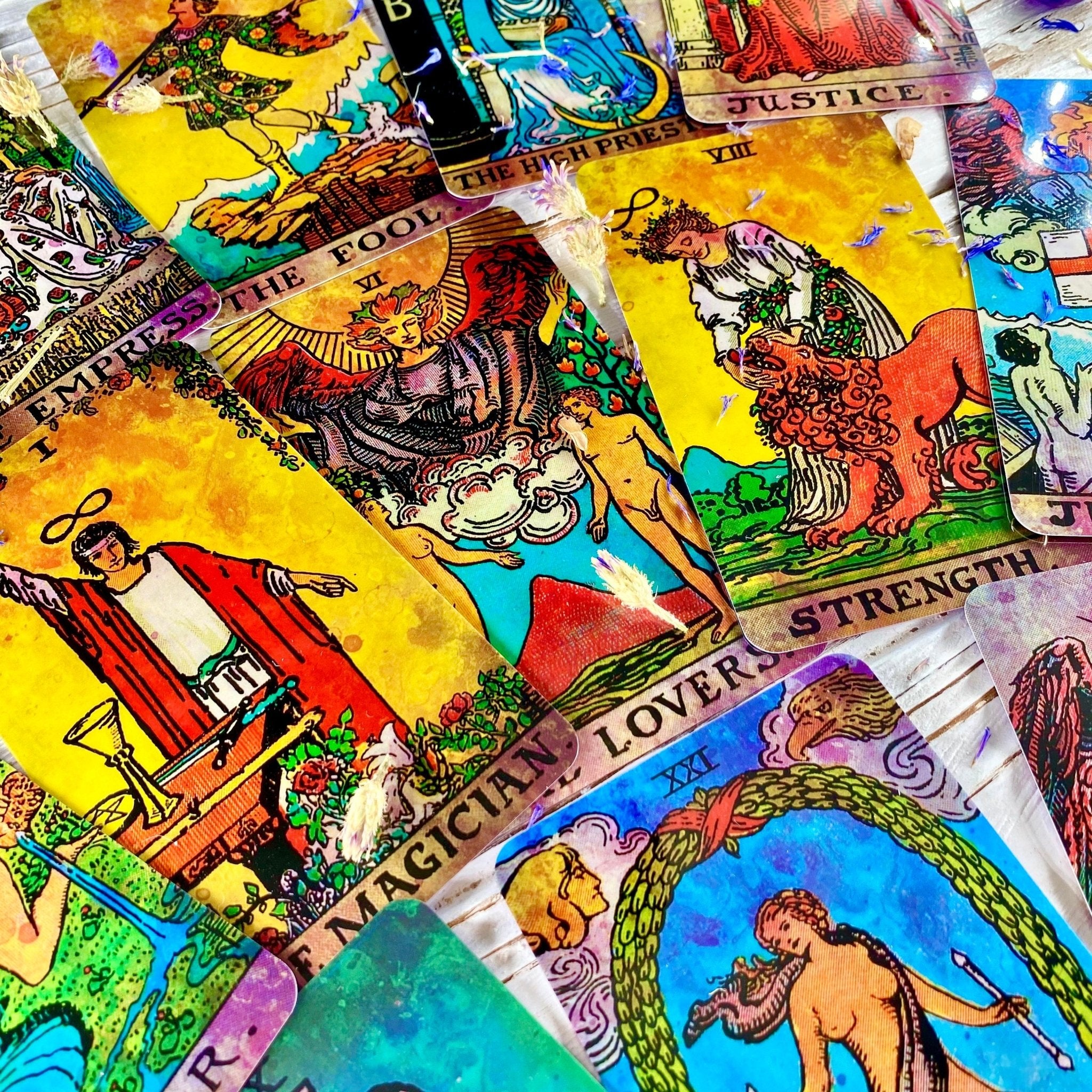 Colorful tarot cards spread out.