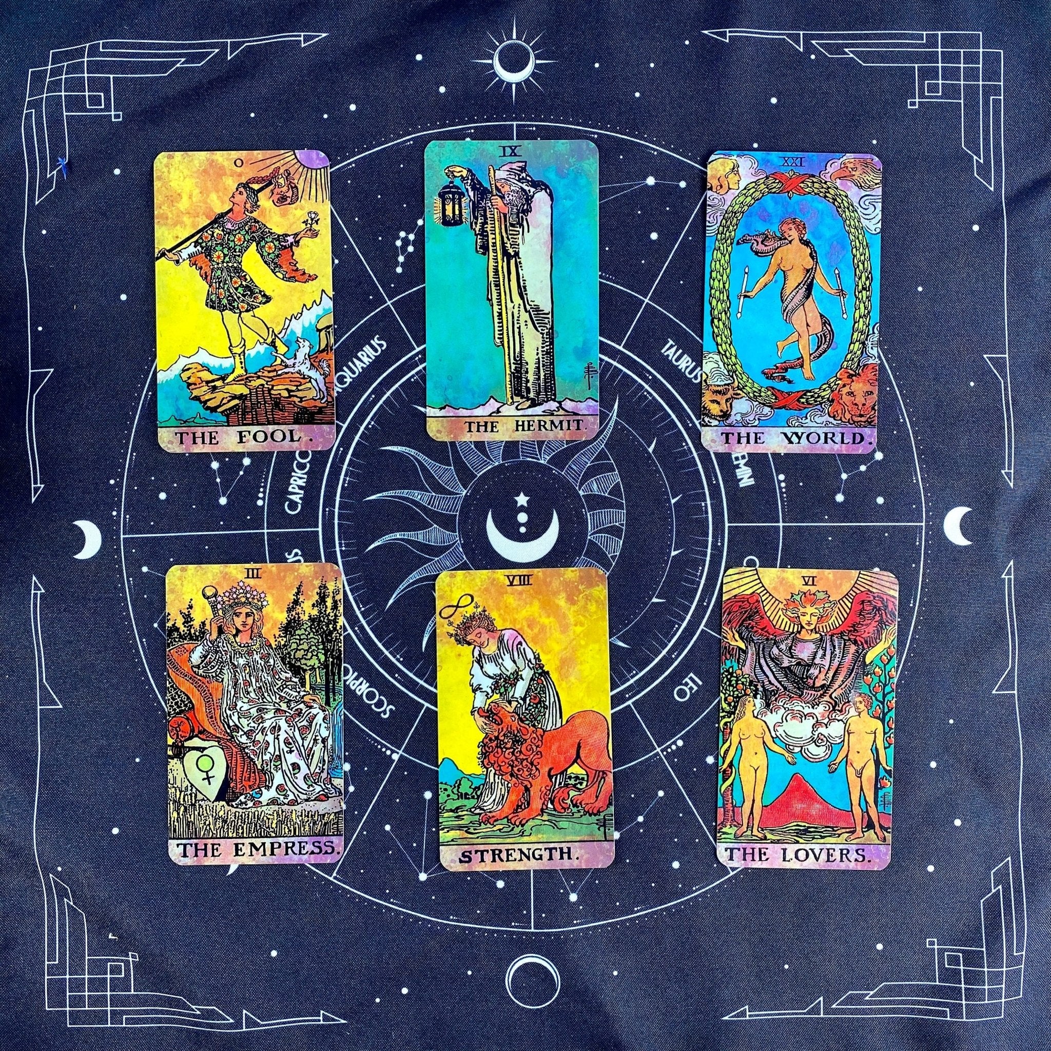 Tarot cards on zodiac cloth.