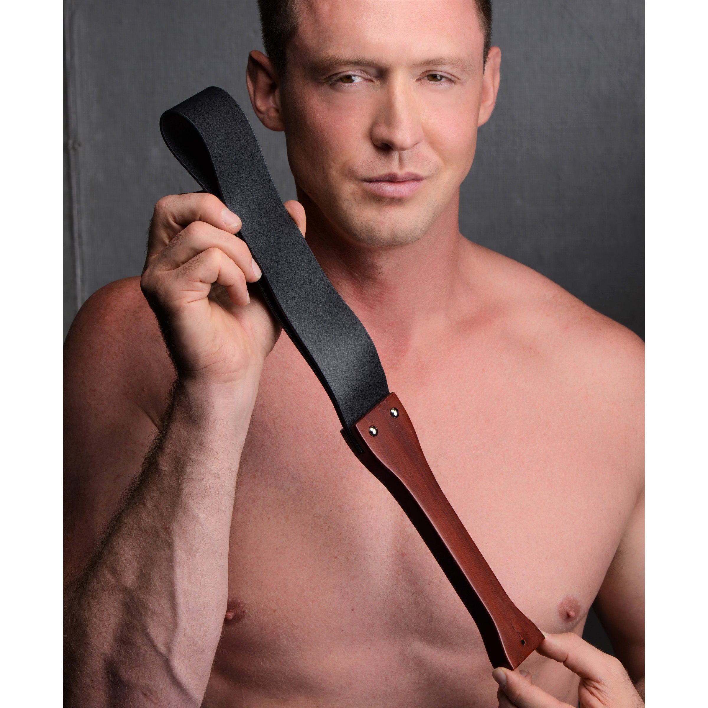 Wooden Slapper with ergonomic handle and PU leather strap, ideal for BDSM play.