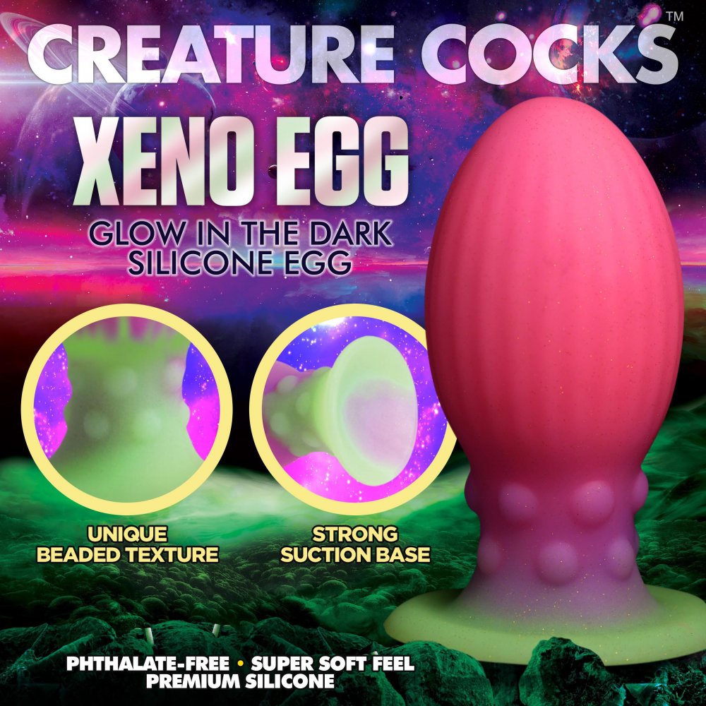 XL Xeno Egg Glow in the Dark Silicone Egg in vibrant pink, purple, and green colors, showcasing its ribbed texture and tapered tip.