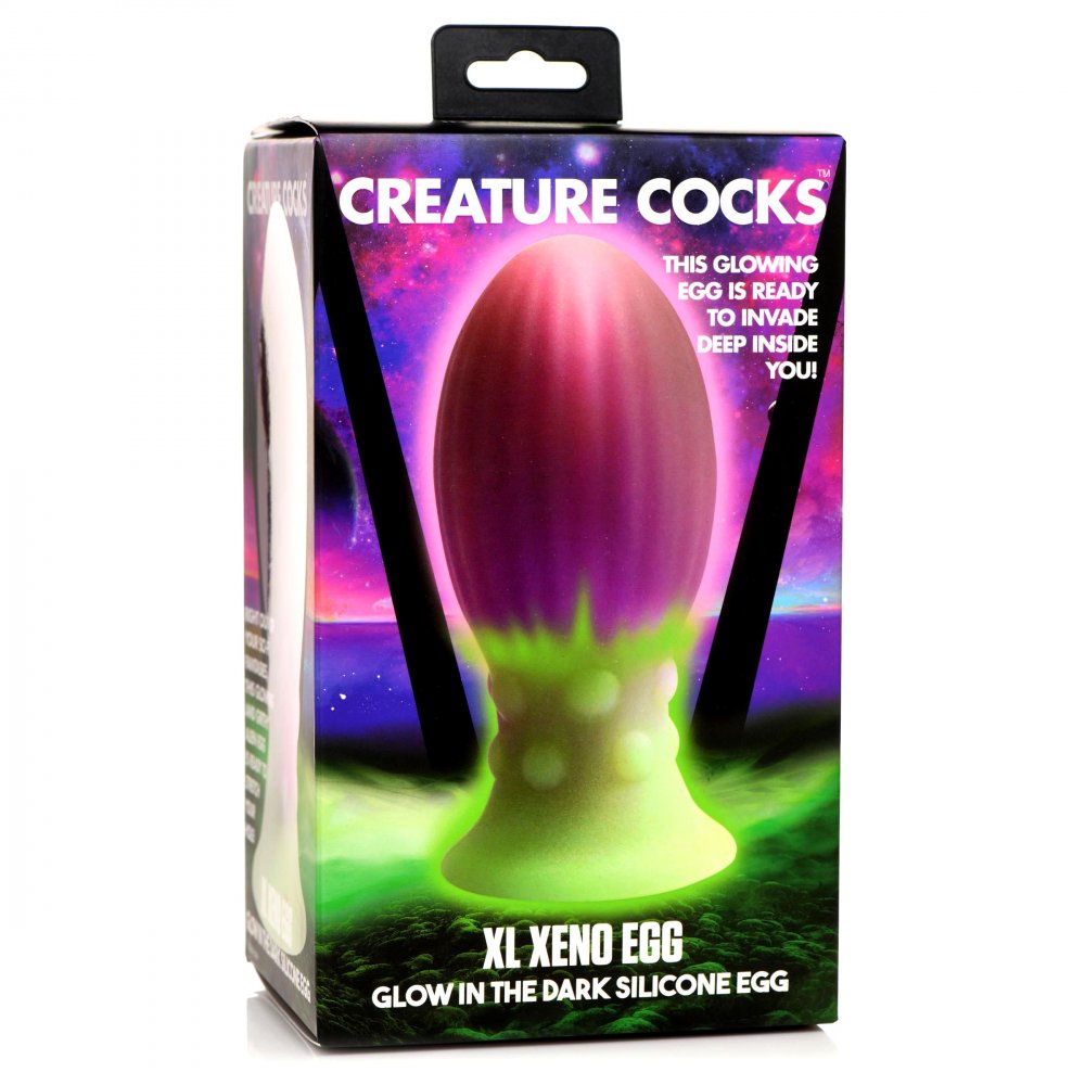 XL Xeno Egg Glow in the Dark Silicone Egg in vibrant pink, purple, and green colors, showcasing its ribbed texture and tapered tip.