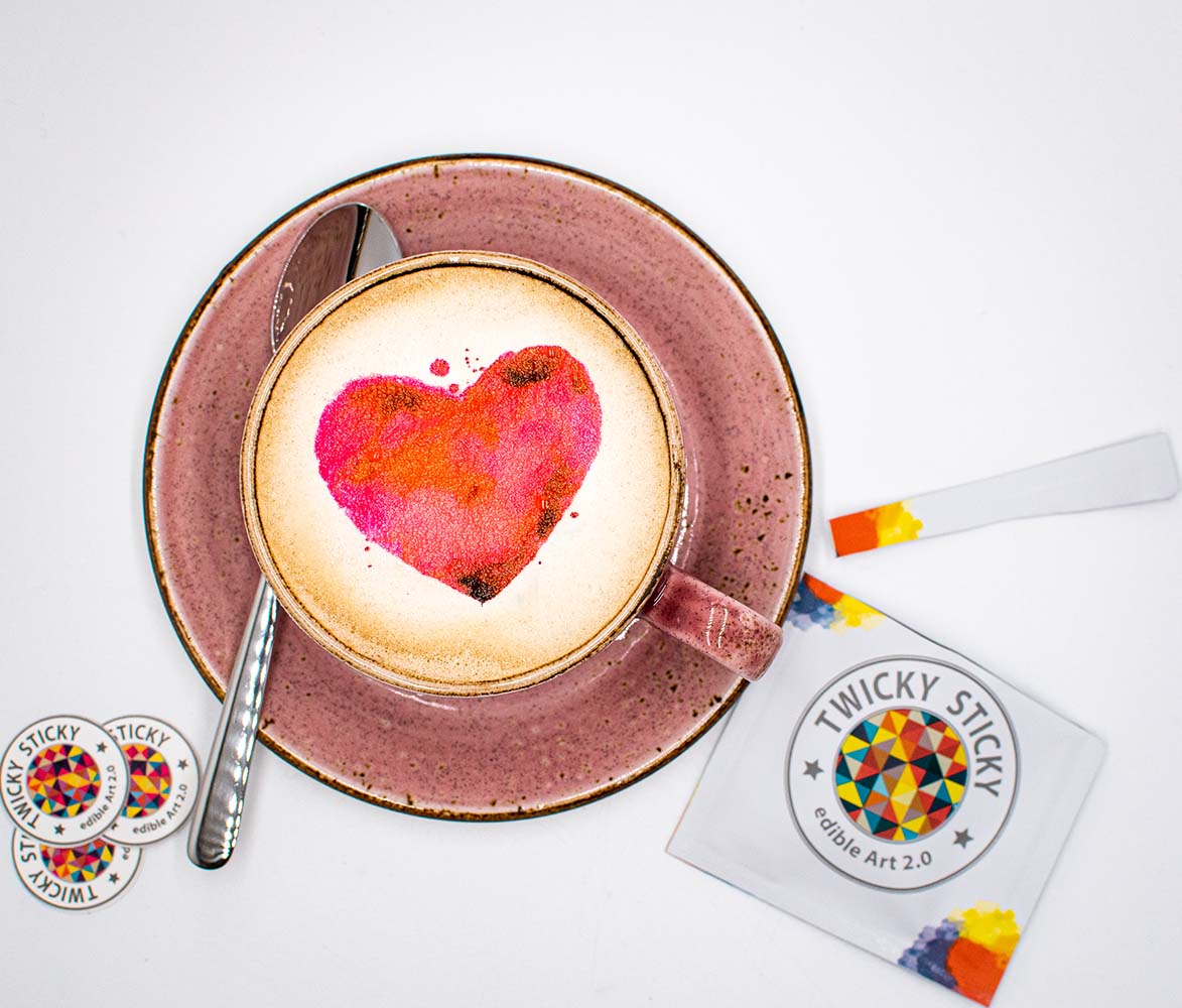 Latte with colorful heart art.