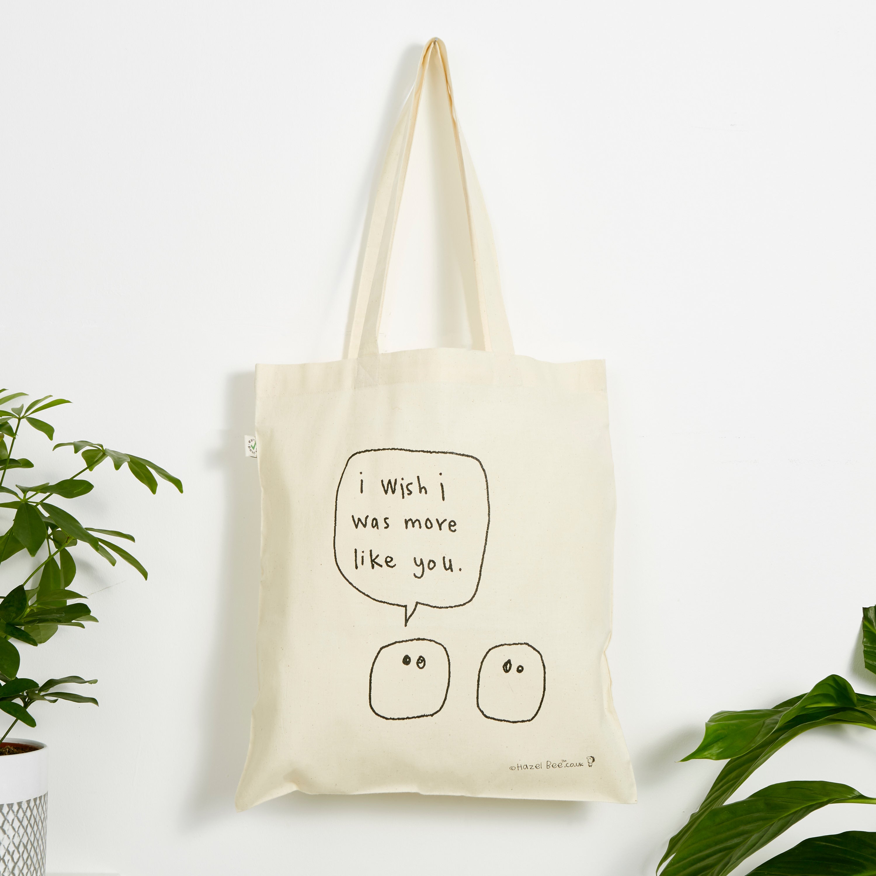 More Like You Blobs Bag made from organic cotton, featuring a hand-printed design in black ink on both sides, perfect for carrying various items.