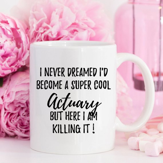 A stylish white ceramic mug featuring a vibrant actuary design, perfect for coffee or tea.