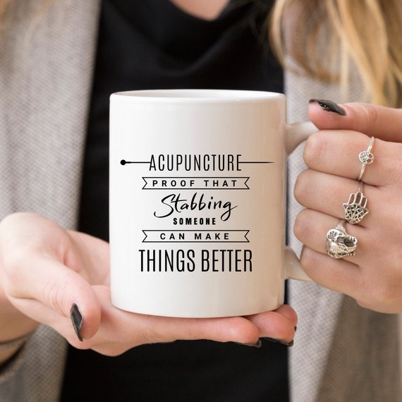 Funny acupuncture coffee mug with humorous text, perfect gift for acupuncturists.