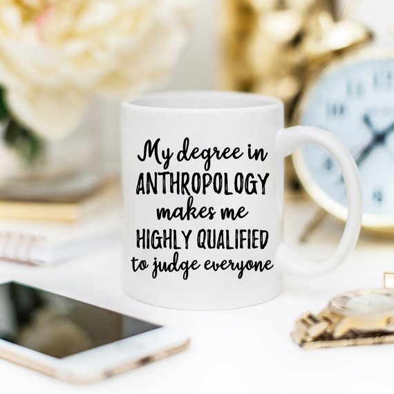 A stylish white anthropology mug featuring a vibrant design printed on both sides, crafted from high-grade ceramic, perfect for coffee lovers.