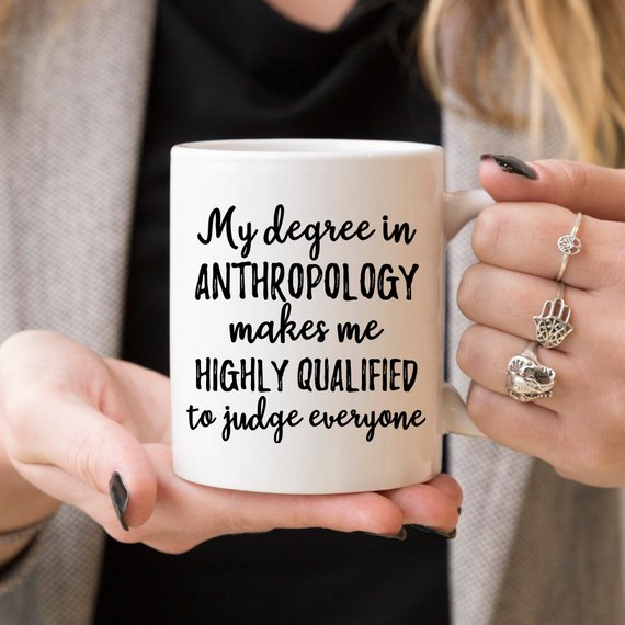 A stylish white anthropology mug featuring a vibrant design printed on both sides, crafted from high-grade ceramic, perfect for coffee lovers.