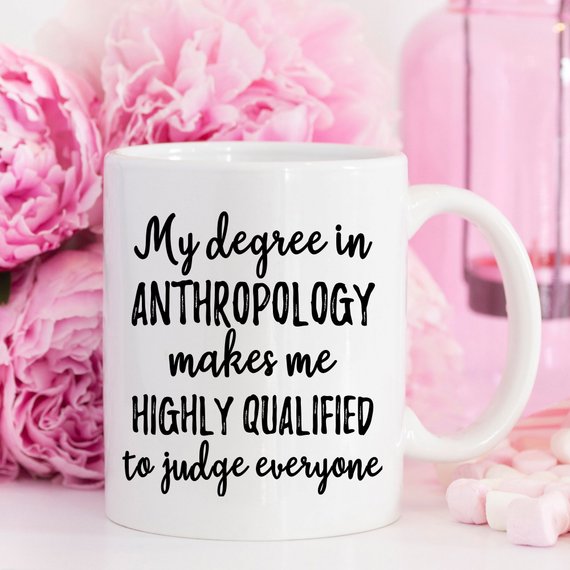 A stylish white anthropology mug featuring a vibrant design printed on both sides, crafted from high-grade ceramic, perfect for coffee lovers.