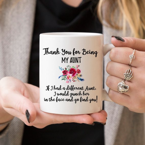 A beautiful white ceramic mug designed for aunts, featuring a vibrant printed design on both sides, available in 11 and 15 oz sizes.