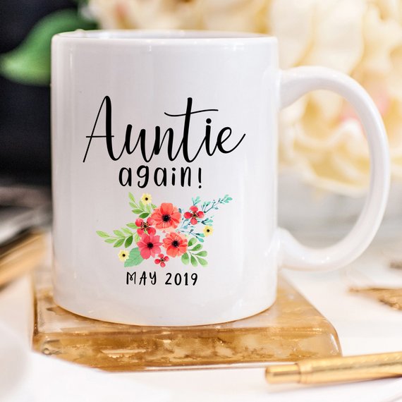 Aunt Pregnancy Announcement Cup featuring a vibrant design, crafted from high-grade ceramic, available in 11 and 15 oz sizes.