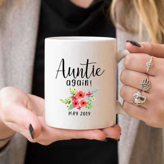 Aunt Pregnancy Announcement Cup featuring a vibrant design, crafted from high-grade ceramic, available in 11 and 15 oz sizes.