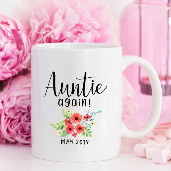 Aunt Pregnancy Announcement Cup featuring a vibrant design, crafted from high-grade ceramic, available in 11 and 15 oz sizes.