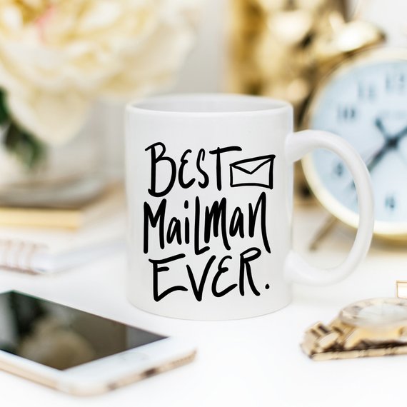 A ceramic coffee mug featuring the text 'Best Mail Man Ever' in a fun design, perfect for postal workers and coffee lovers.