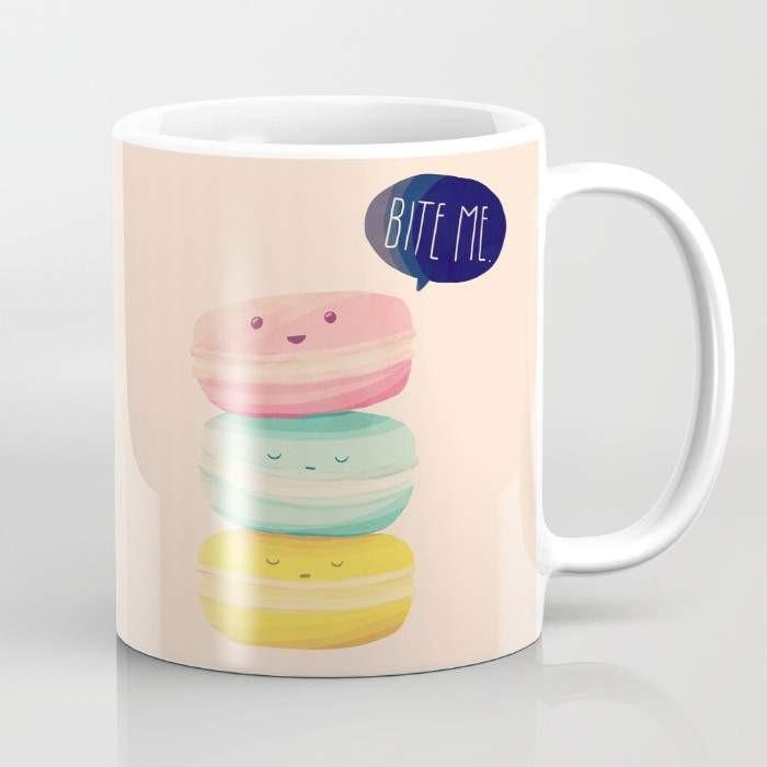 A stylish 15-ounce ceramic coffee mug with a unique 'Bite Me' wrap-around design and a large handle for easy gripping.